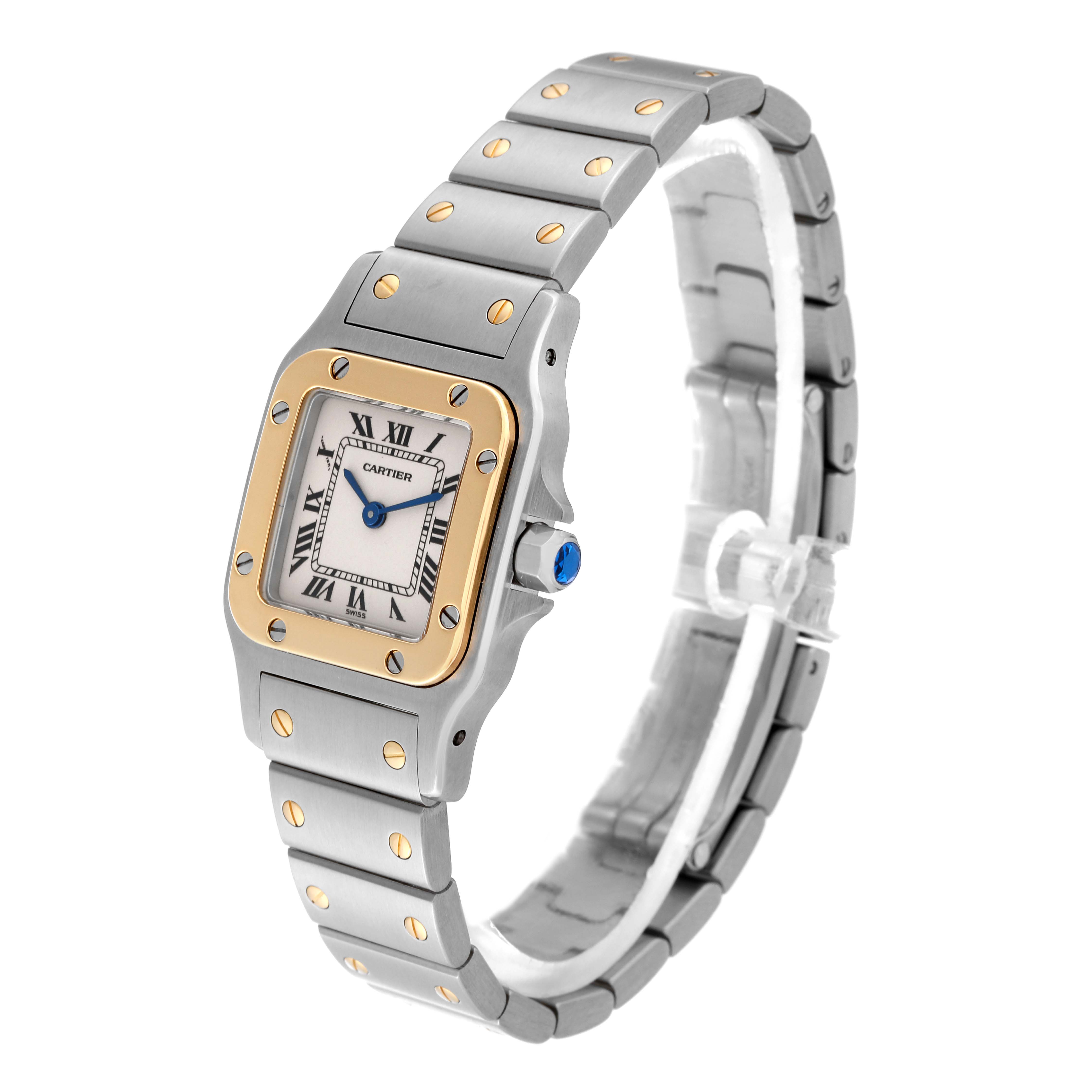 This Cartier Santos W20012C4 Women's Steel and Gold (two tone) Silver Dial W20012C4 Women's Steel and Gold (two tone) Silver Dial watch is shown at a three-quarter angle, displaying its face, bezel, bracelet, and crown.