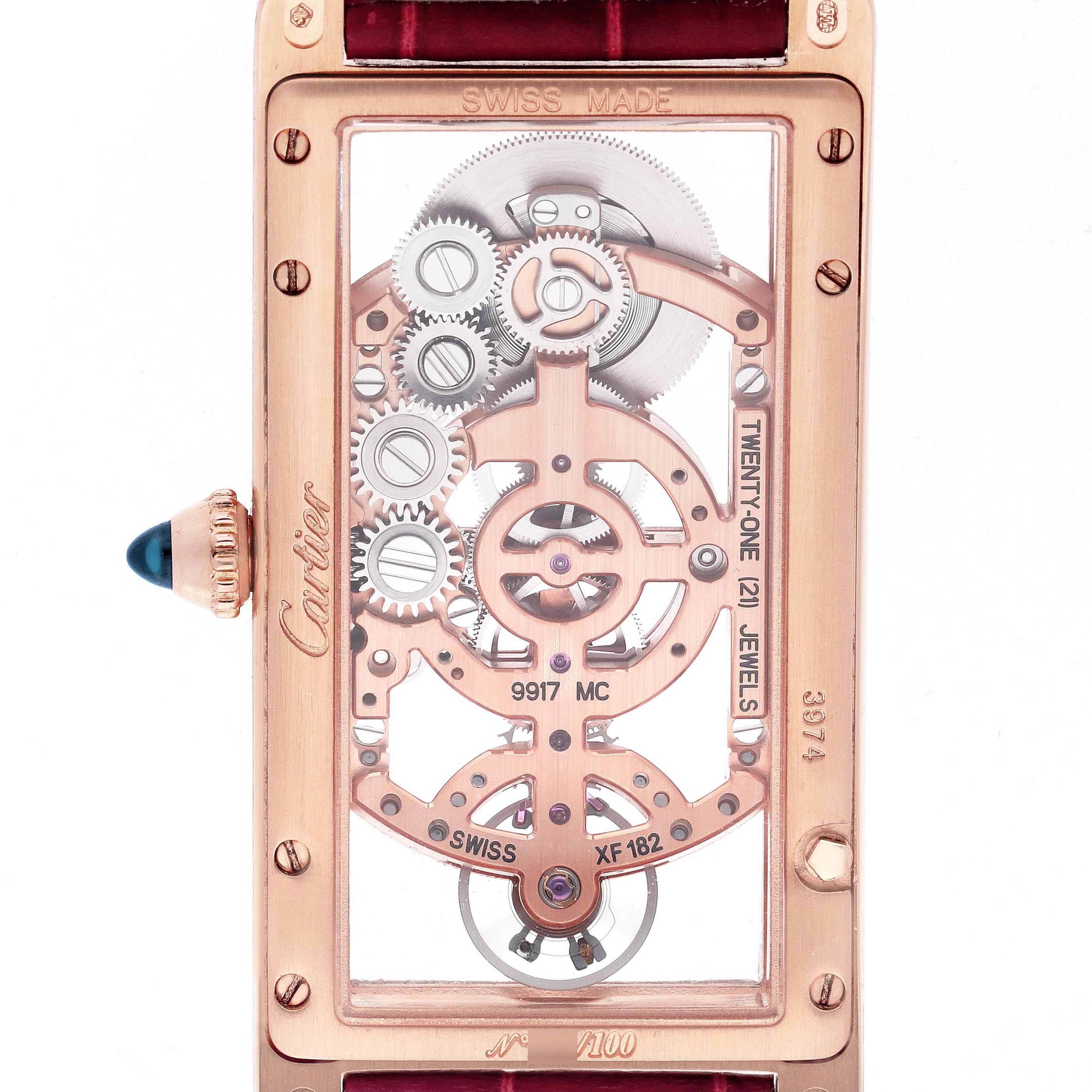 The image shows the back of the Cartier Tank Cintree WHTA0008 Men's Rose Gold Transparent Dial watch, highlighting the exposed gears and jewel details.