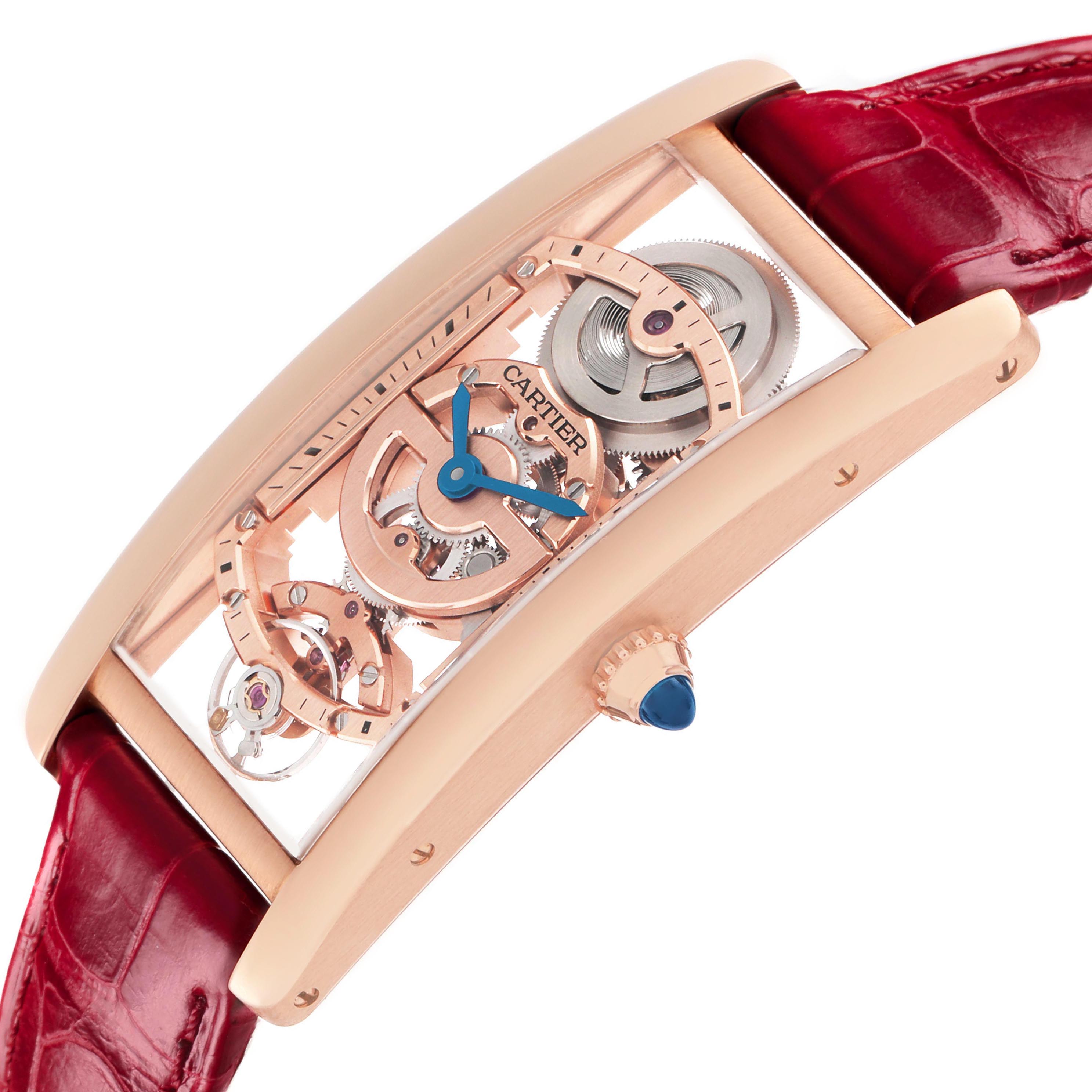 The Cartier Tank Cintree WHTA0008 Men's Rose Gold Transparent Dial watch is shown at an angle highlighting its skeleton dial, rose gold case, crown with a blue cabochon, and red leather strap.