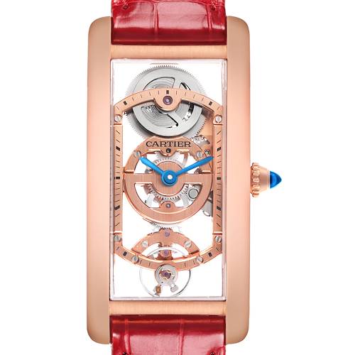 The Cartier Tank Cintrée watch is shown from a front angle, displaying its skeleton dial and red leather strap.
