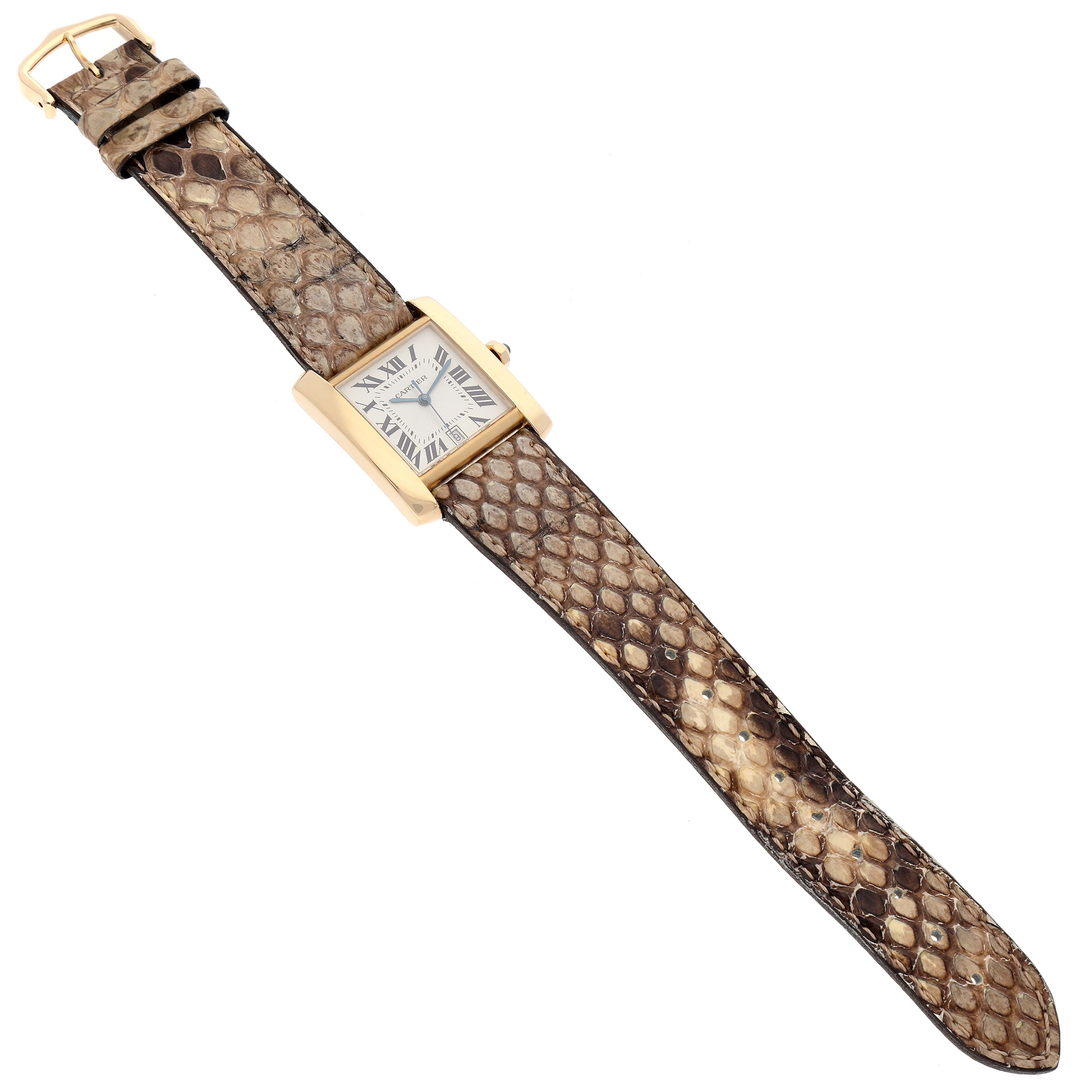 This image shows a Cartier Tank Francaise W5000156 Men's Yellow Gold Silver Dial W5000156 Men's Yellow Gold Silver Dial watch with a snakeskin strap viewed from a top-down angle.