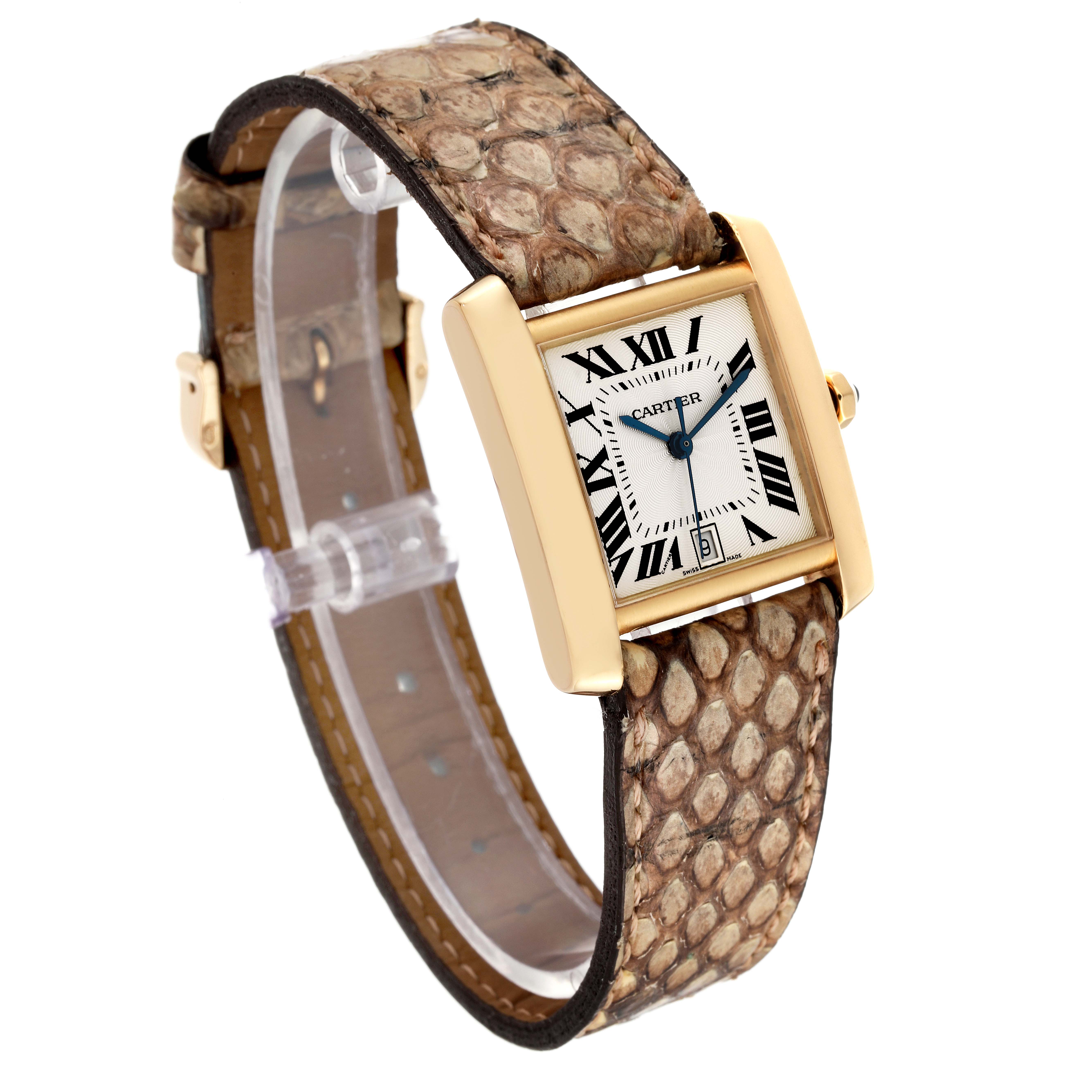 The Cartier Tank Francaise W5000156 Men's Yellow Gold Silver Dial W5000156 Men's Yellow Gold Silver Dial watch is shown at an angle highlighting its rectangular face, gold case, and textured leather strap.