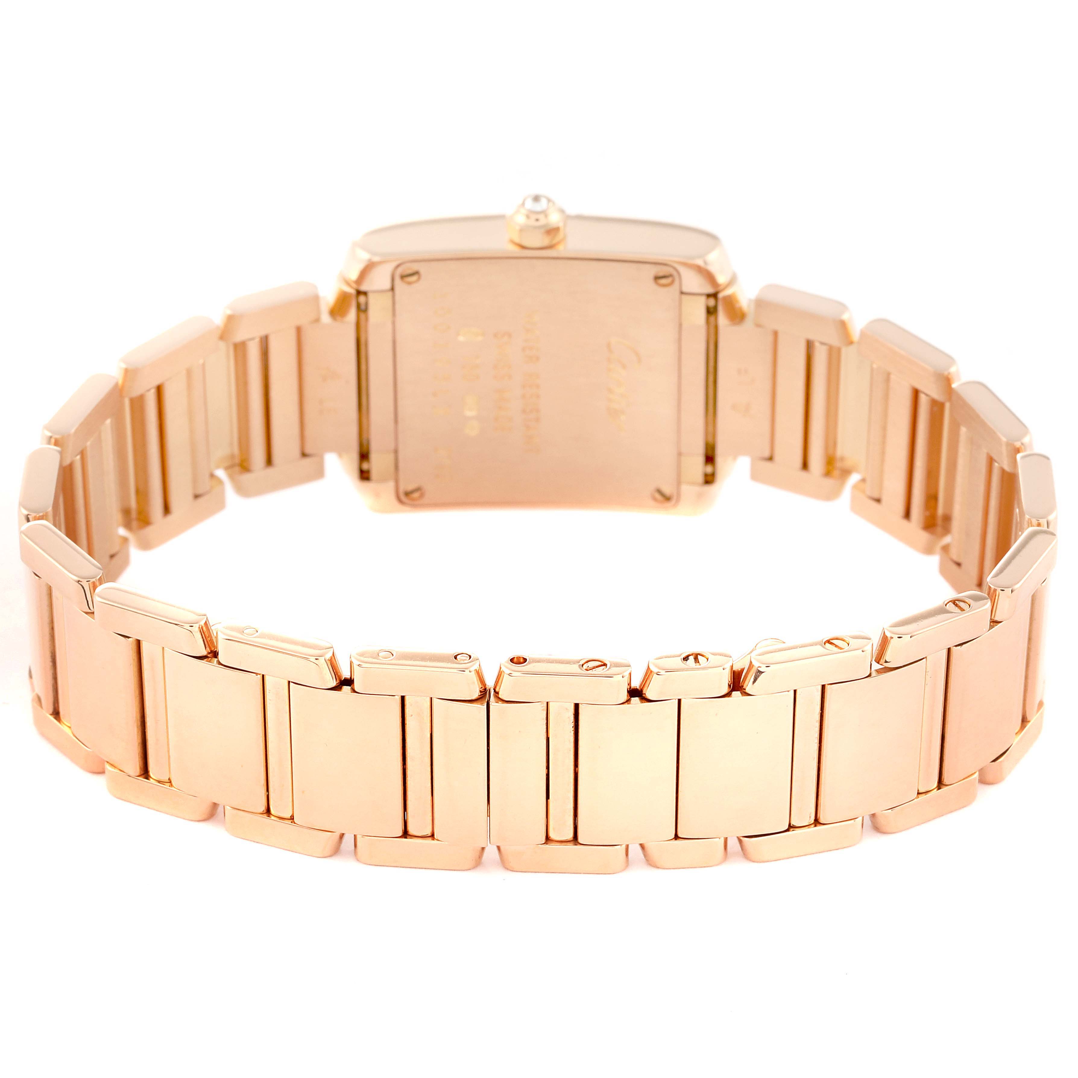 The image shows the back view of the Cartier Tank Francaise WJTA0022 Women's Rose Gold Silver Dial WJTA0022 Women's Rose Gold Silver Dial watch, focusing on its gold metal bracelet and case back.
