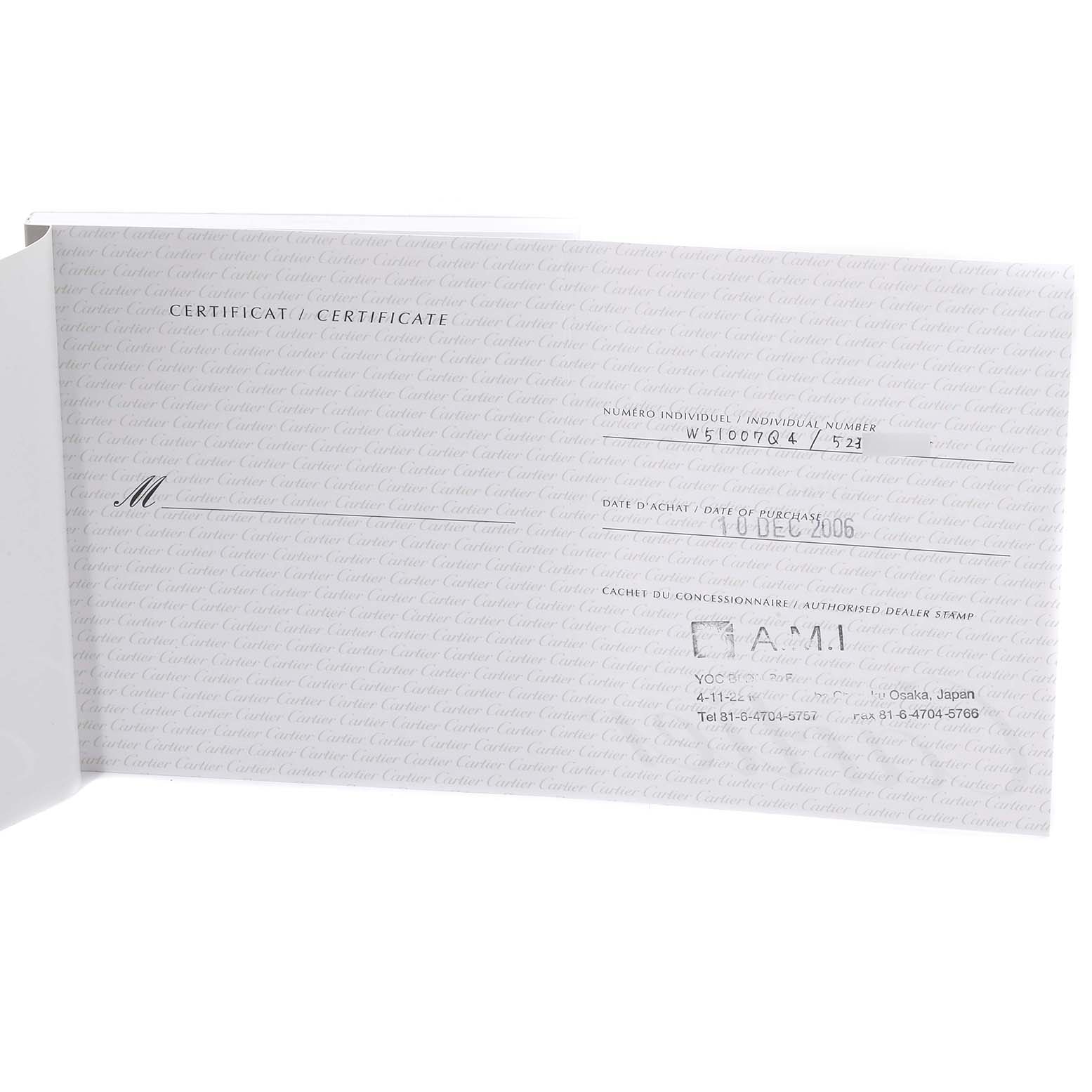 The image shows a partially open warranty booklet for a Tank Francaise model by Cartier, displaying purchase details and dealer information.