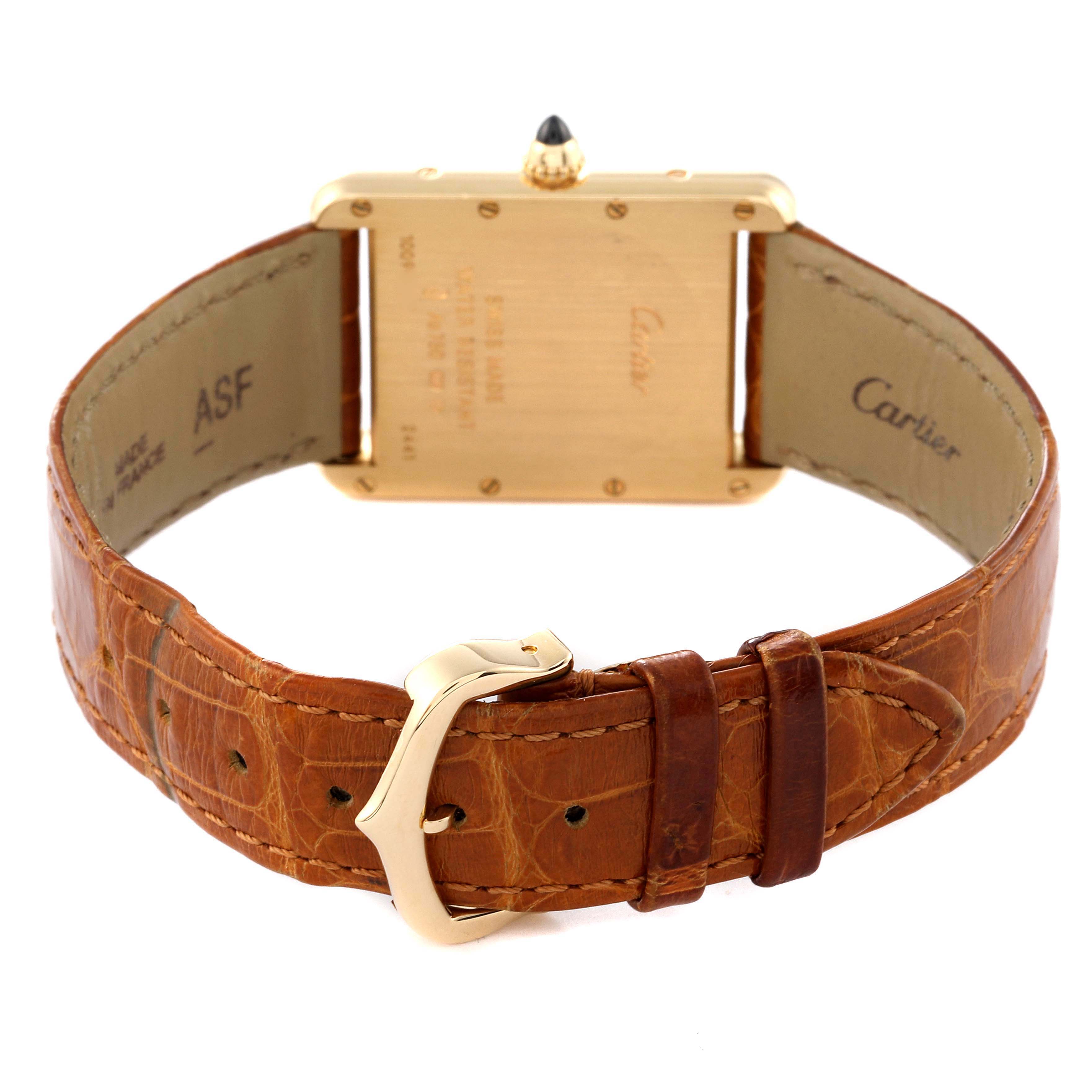 The image shows the back view of a Cartier Tank Louis W1529756 Men
s Yellow Gold Silver Dial W1529756 Men
s Yellow Gold Silver Dial watch, focusing on the case back, strap, and buckle.