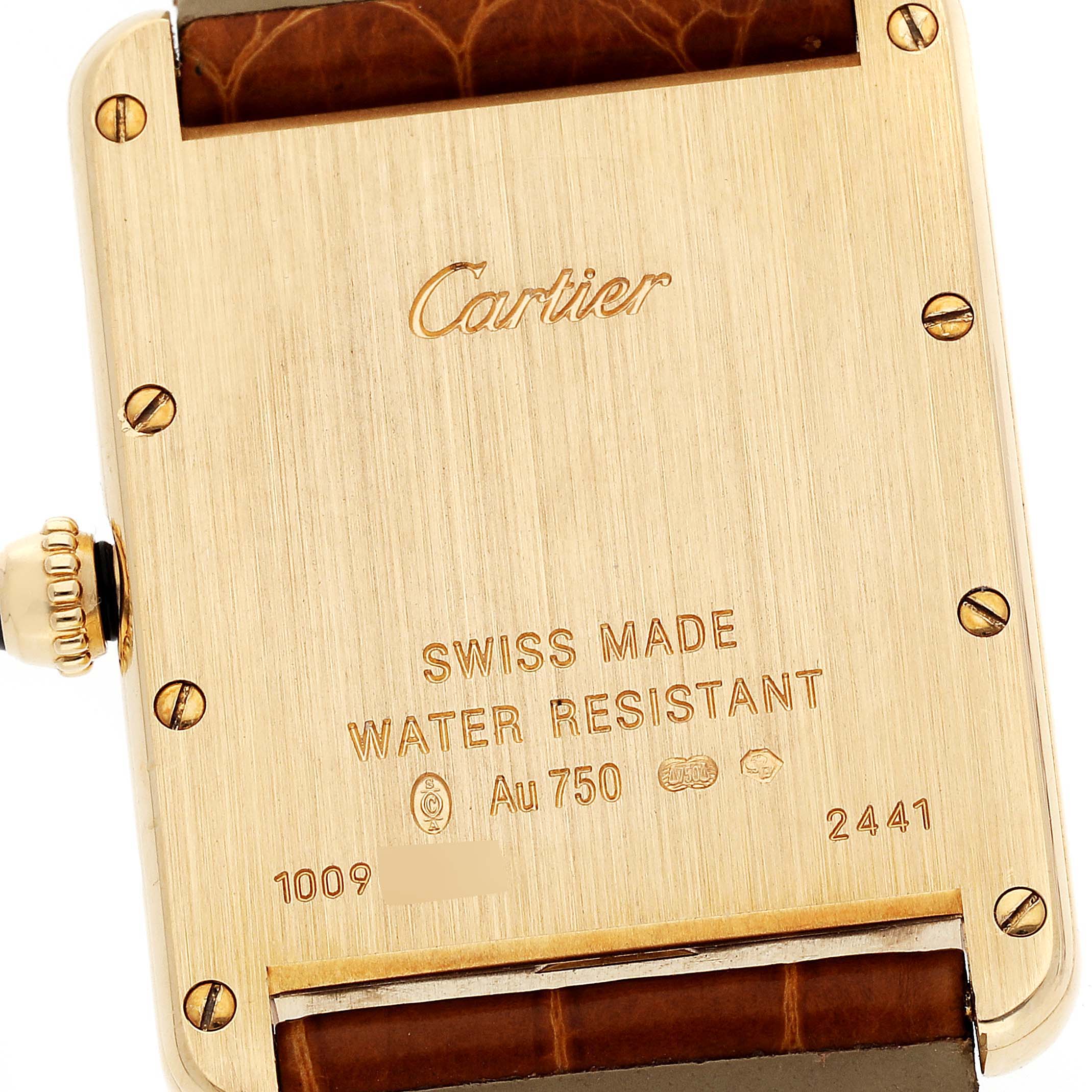 The image shows the back of a Cartier Tank Louis W1529756 Men
s Yellow Gold Silver Dial W1529756 Men
s Yellow Gold Silver Dial watch, displaying the brand name, inscriptions, screws, and part of the leather strap.