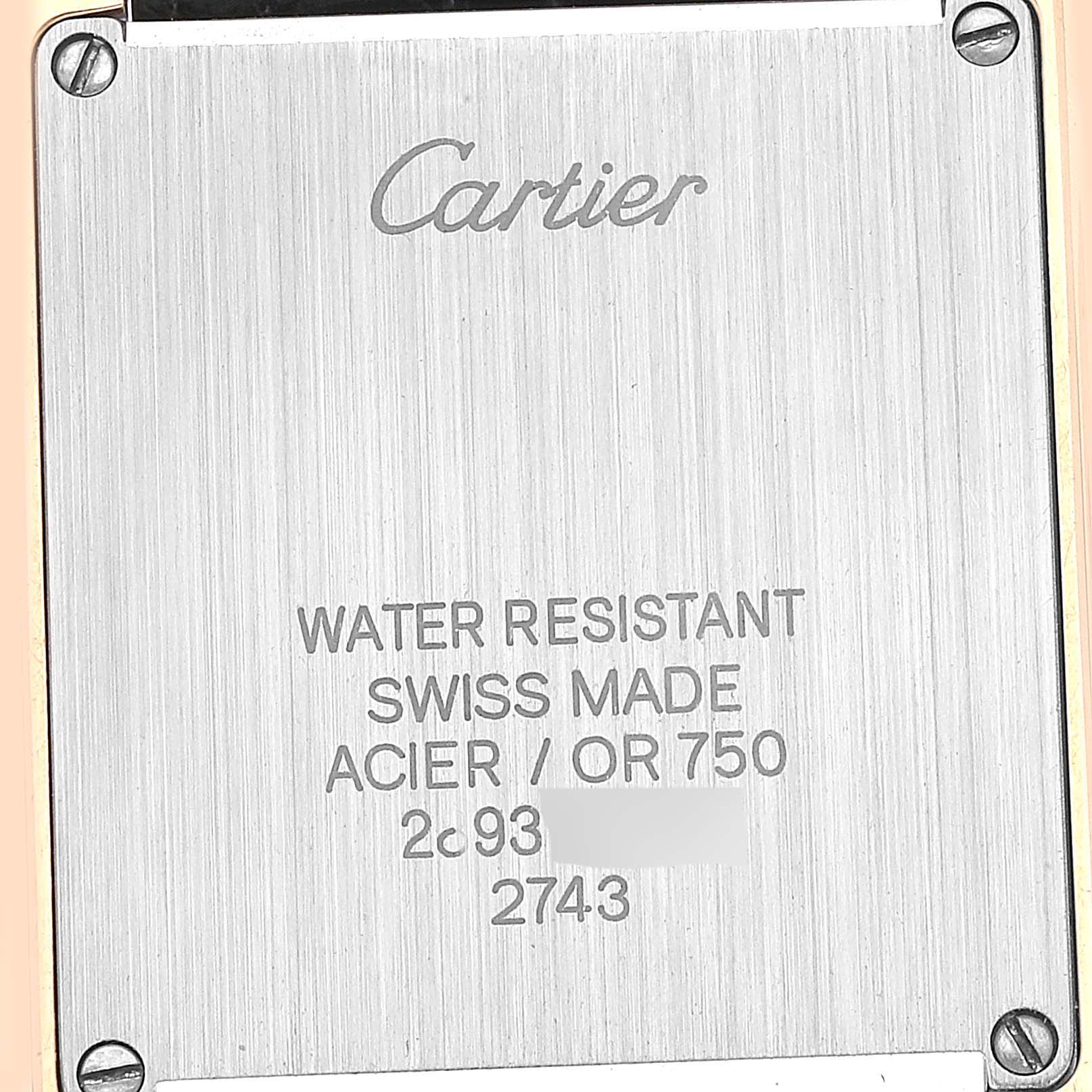 This image shows the back casing of a Cartier Tank Solo W1018755 Women's Yellow Gold Silver Dial W1018755 Women's Yellow Gold Silver Dial watch, featuring engraved text and details.