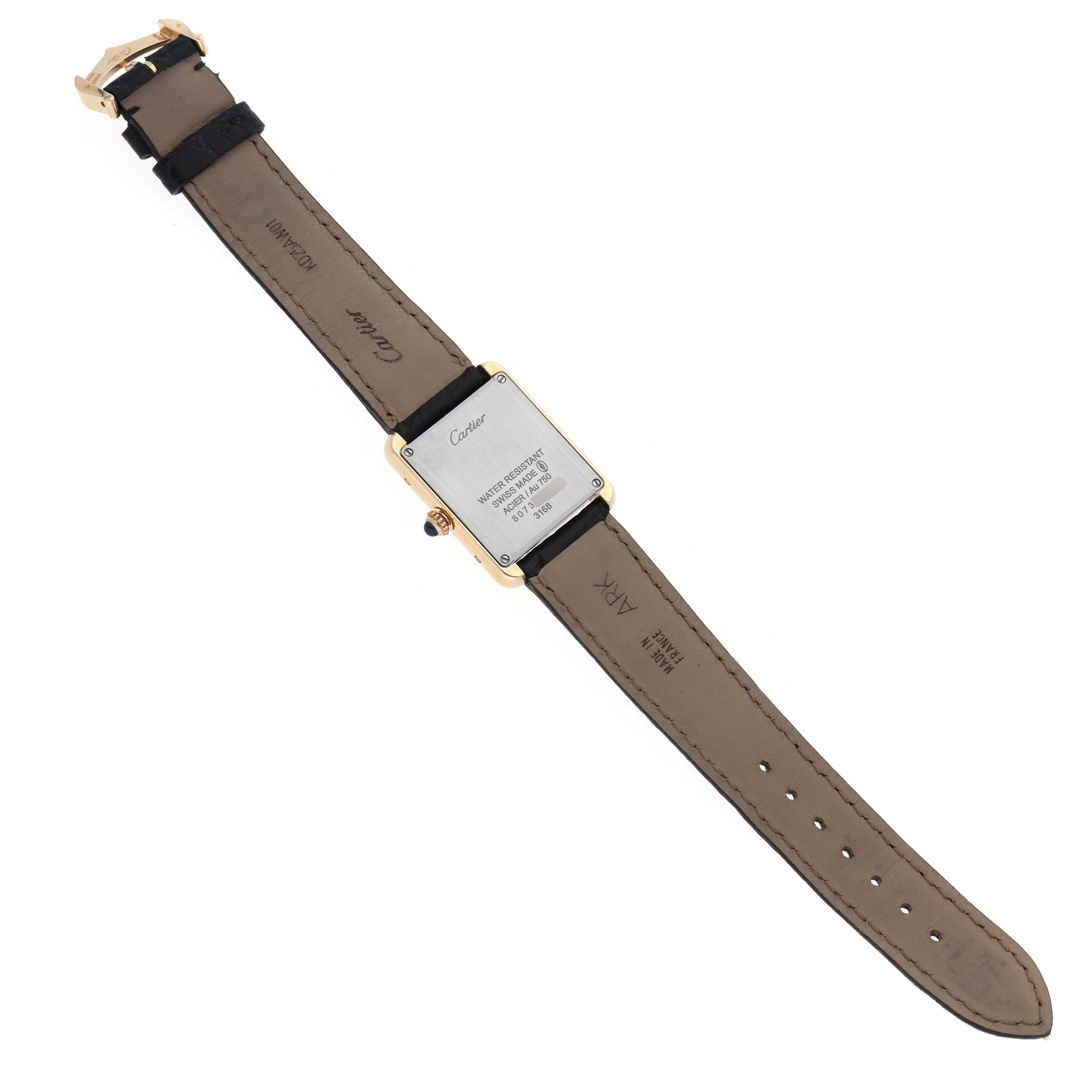 The image shows the back view of a Tank Solo watch by Cartier, highlighting its case back and leather strap.