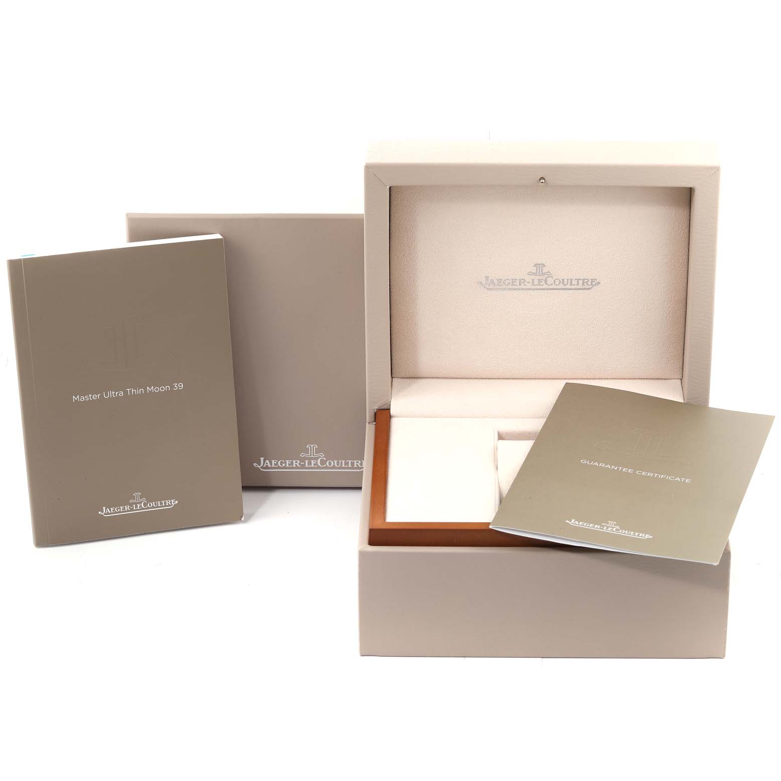 The image shows the packaging, guarantee certificate, and instruction manual for the Jaeger-LeCoultre Master Ultra Thin Moon 39.