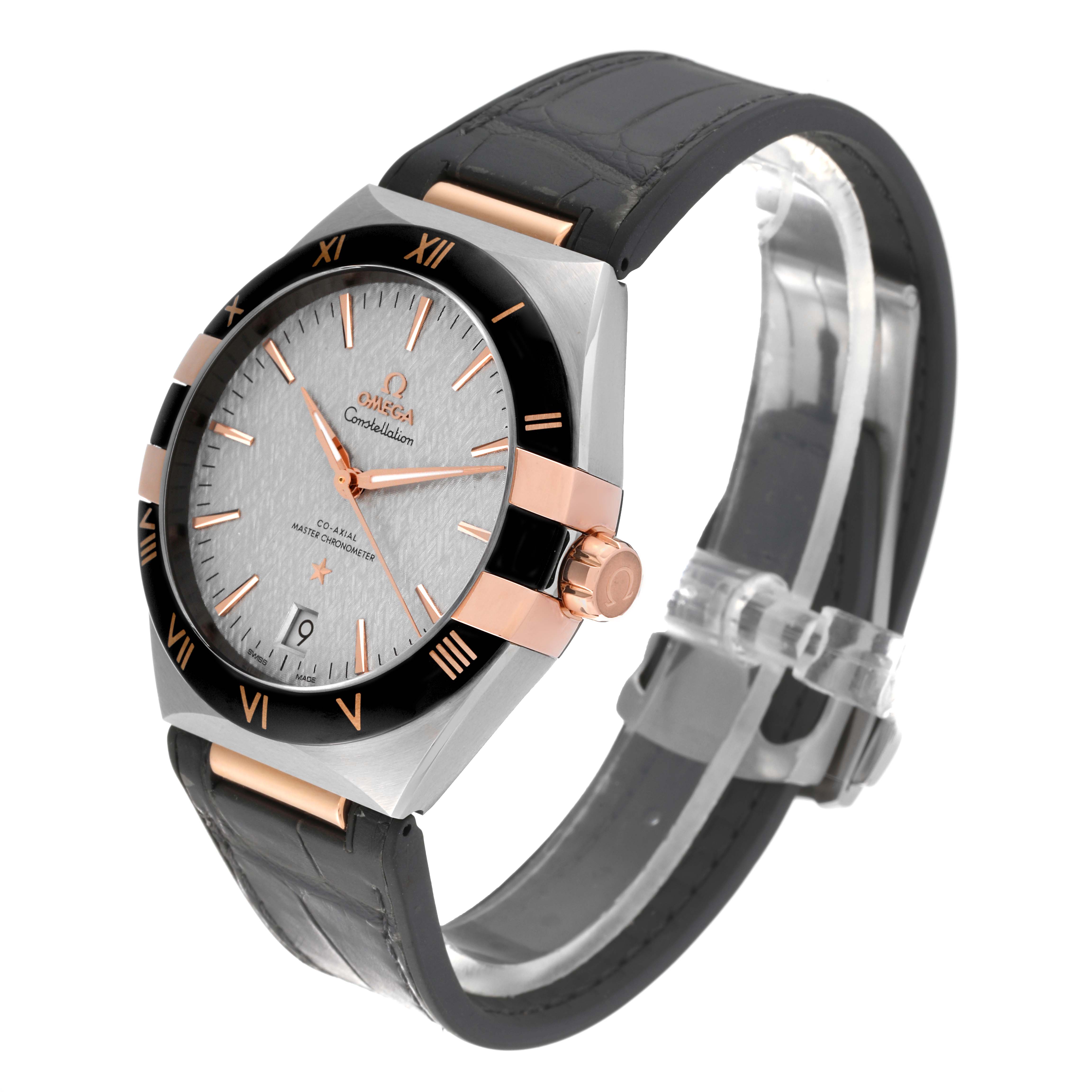 The image shows a side-angle view of an Omega Constellation 131.23.41.21.06.001 Men's Steel and Gold (two tone) Silver Dial 131.23.41.21.06.001 Men's Steel and Gold (two tone) Silver Dial watch, showcasing its face, bezel, crown, and part of the strap.