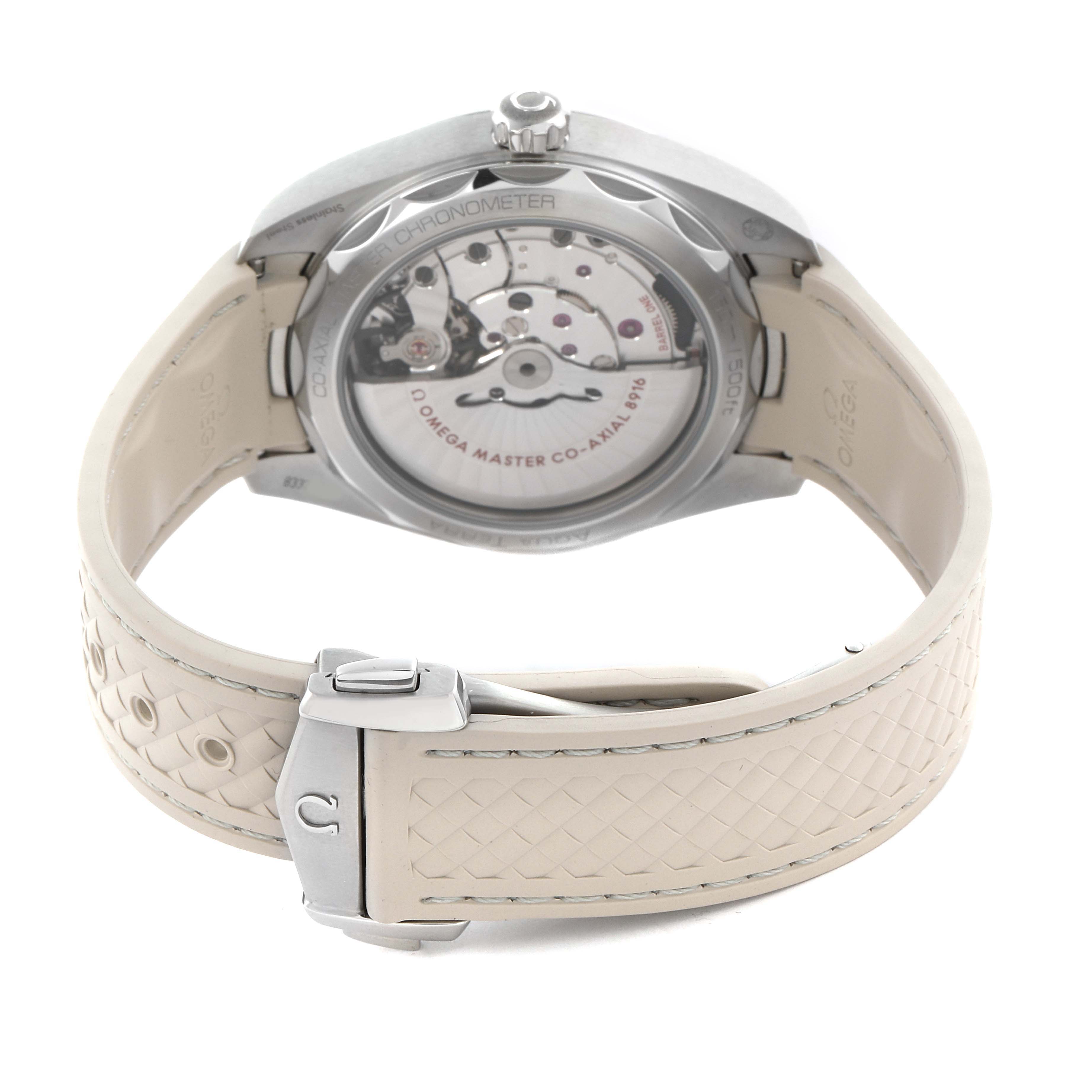 The Omega Aqua Terra 220.12.41.21.02.005 Men's Stainless Steel Silver Dial 220.12.41.21.02.005 Men's Stainless Steel Silver Dial watch is shown from the back, displaying its transparent case back and beige strap with a clasp.