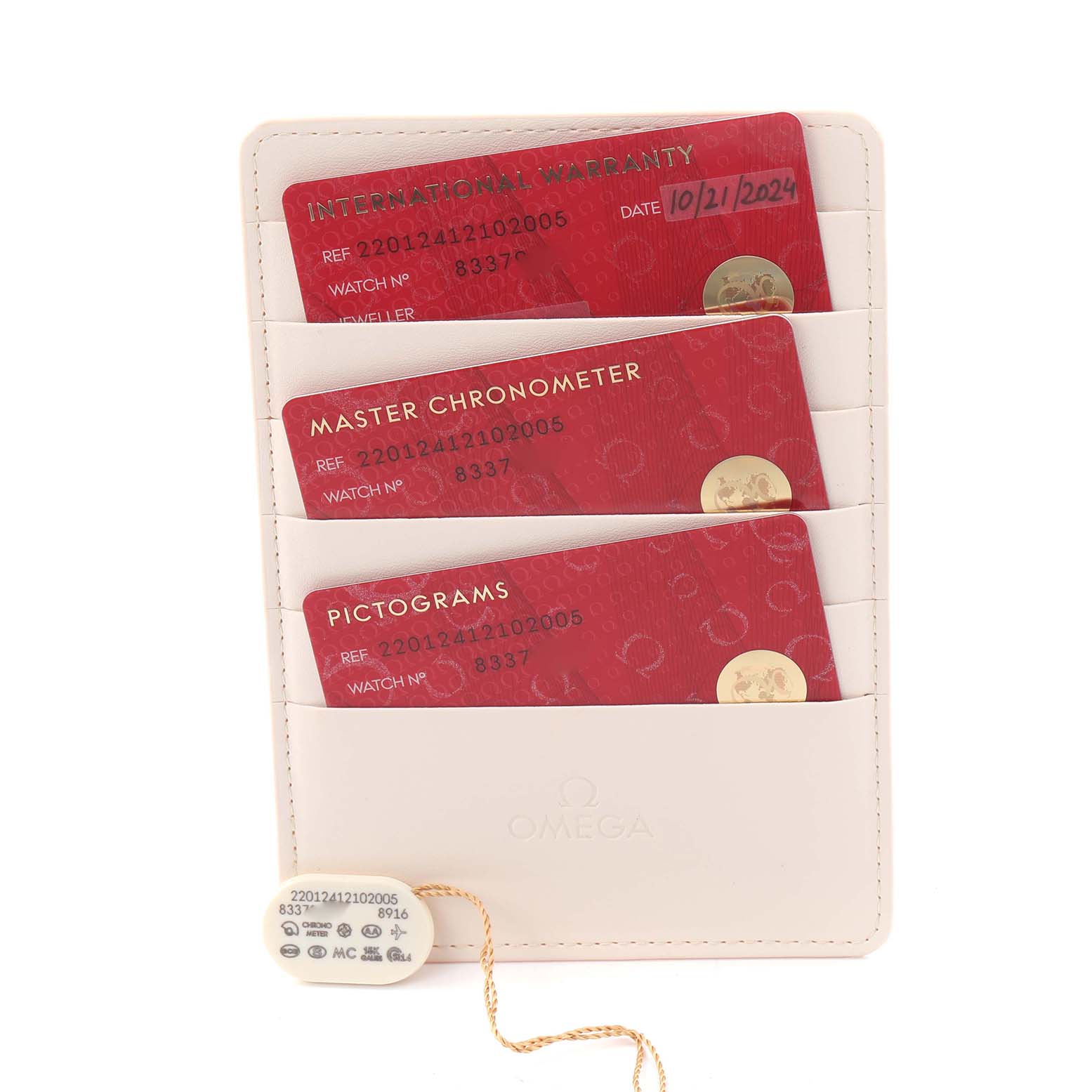 The image shows warranty cards and tags for the Omega Aqua Terra 220.12.41.21.02.005 Men's Stainless Steel Silver Dial 220.12.41.21.02.005 Men's Stainless Steel Silver Dial model, displayed in a branded holder.