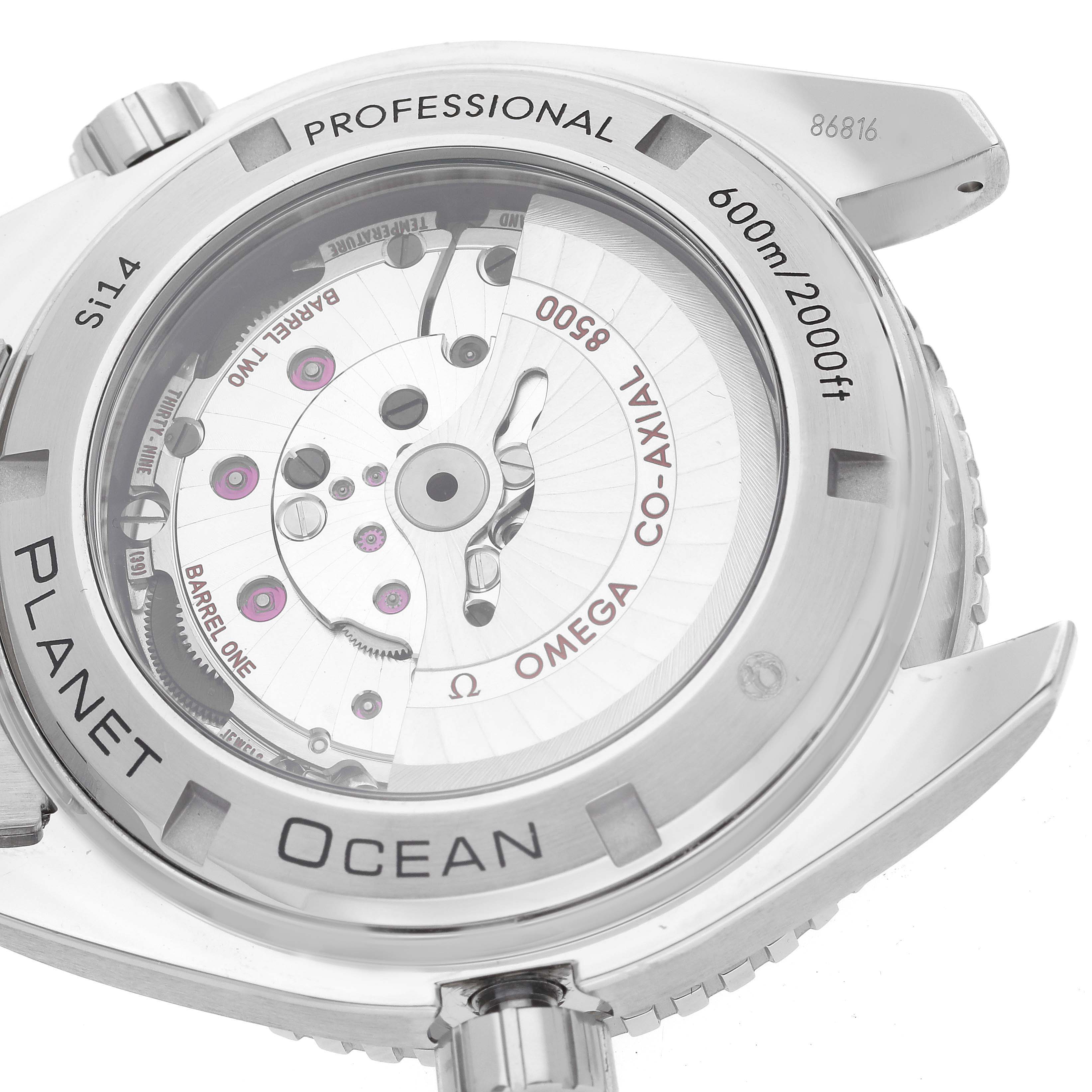 The image shows the back of the Omega Planet Ocean 232.30.46.21.01.001 Men
s Stainless Steel Black Dial 232.30.46.21.01.001 Men
s Stainless Steel Black Dial watch, highlighting its movement mechanism and specifications.