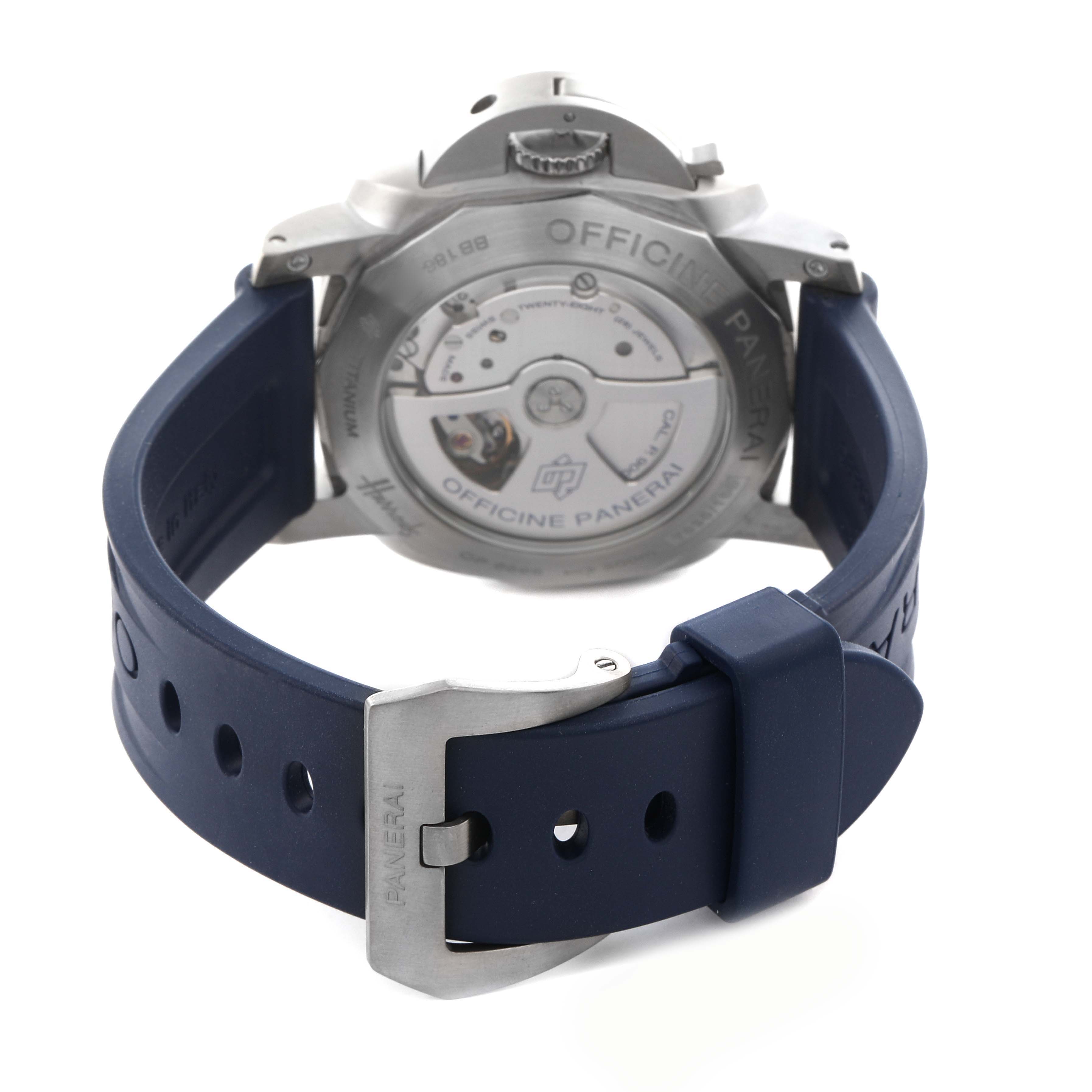The image shows the back of a Panerai Luminor PAM00745 Men's Titanium Blue Dial PAM00745 Men's Titanium Blue Dial watch, displaying the movement and blue strap with a buckle.