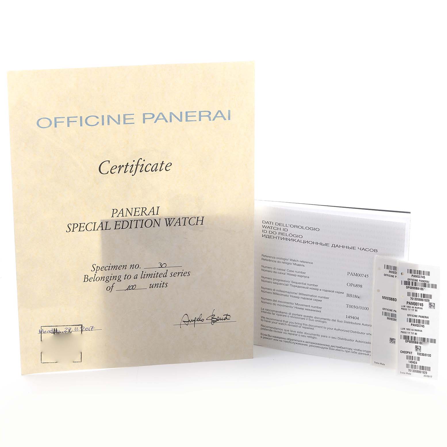 The image shows the certificate and documentation for the Panerai Luminor PAM00745 Men's Titanium Blue Dial PAM00745 Men's Titanium Blue Dial watch from a high angle.