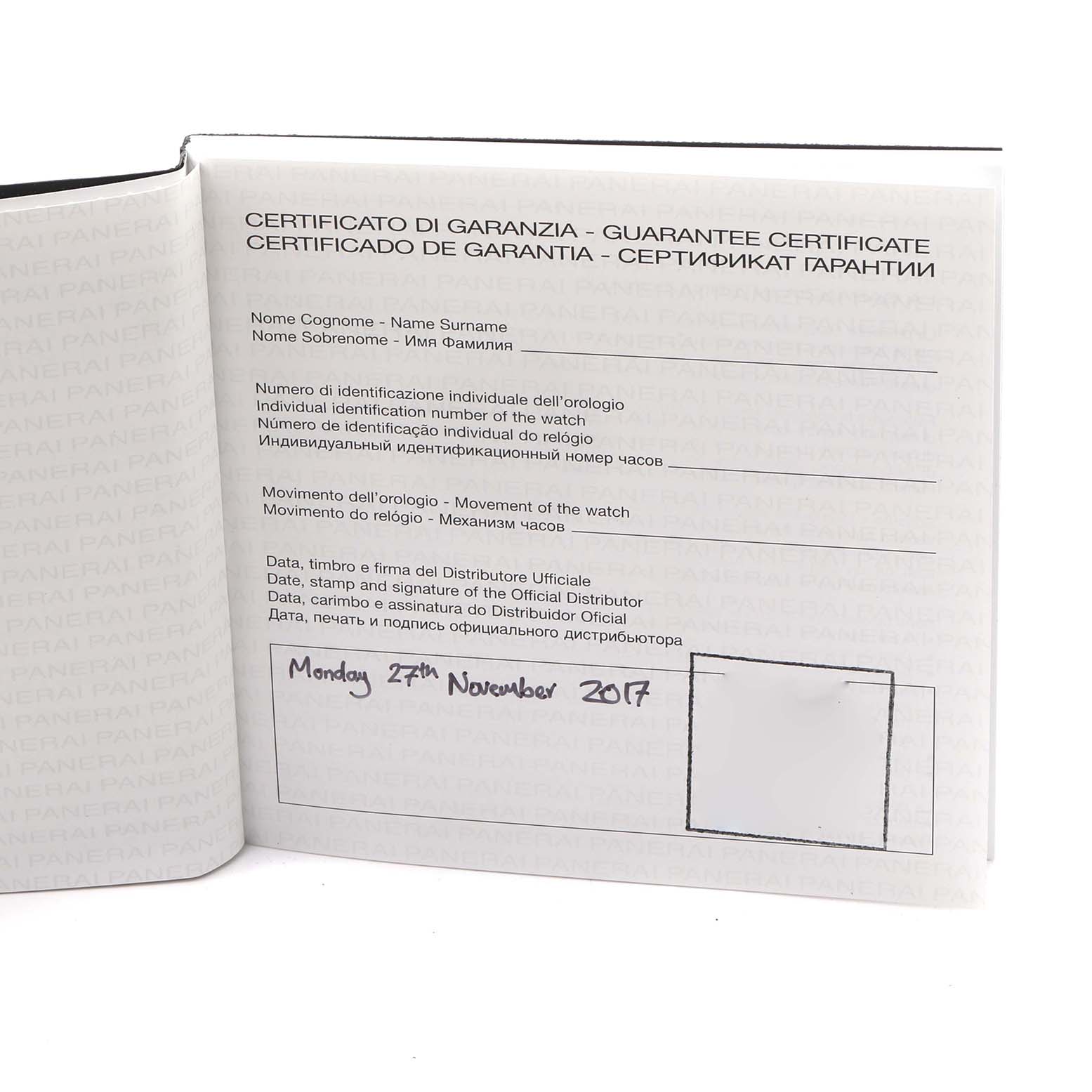 The image shows a guarantee certificate booklet for a Panerai Luminor PAM00745 Men's Titanium Blue Dial PAM00745 Men's Titanium Blue Dial watch, displaying text pages with handwritten details.