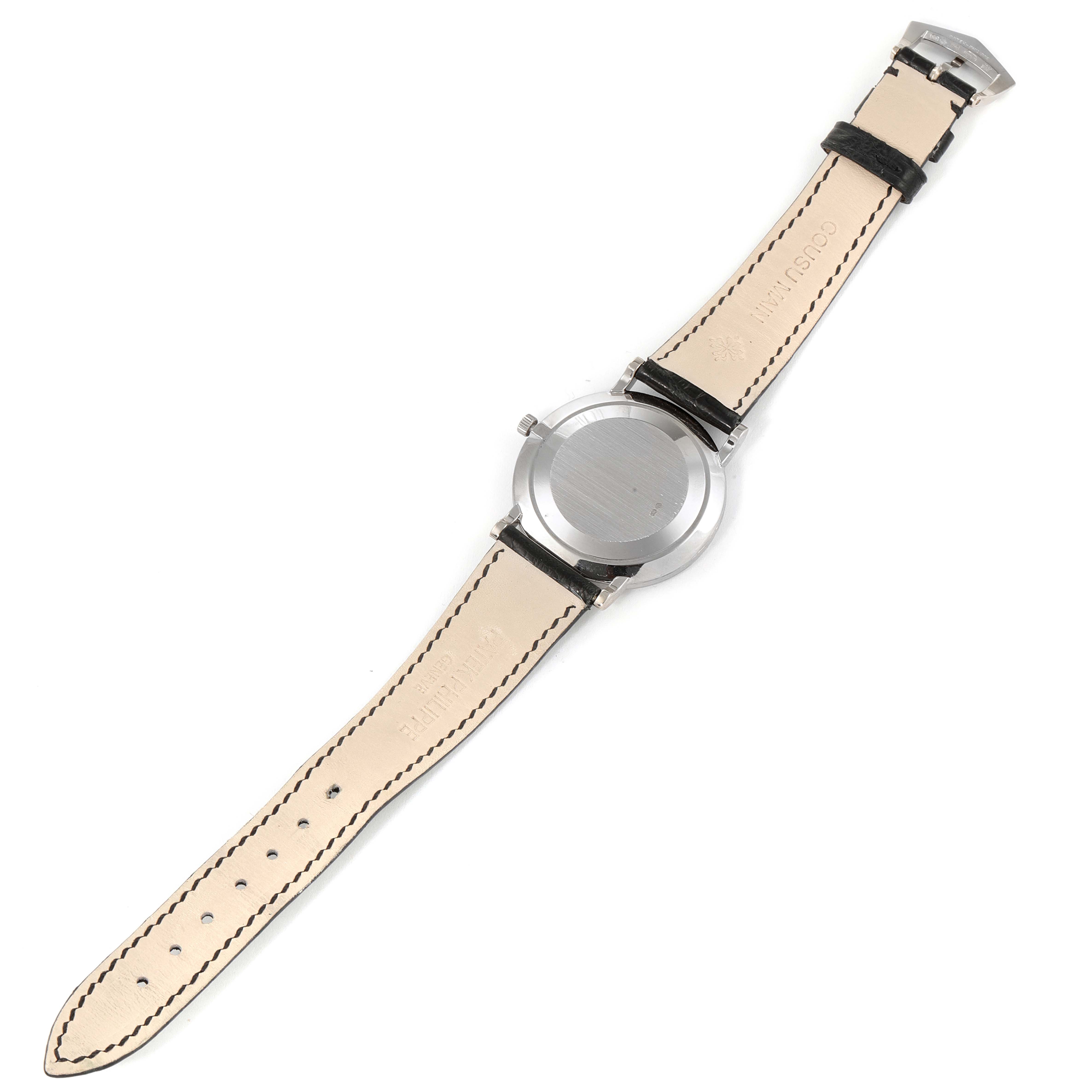 The image shows the back and strap of a Patek Philippe Calatrava 3919G Men's White Gold White Dial 3919G Men's White Gold White Dial watch, laid flat, displaying the case back and leather straps.