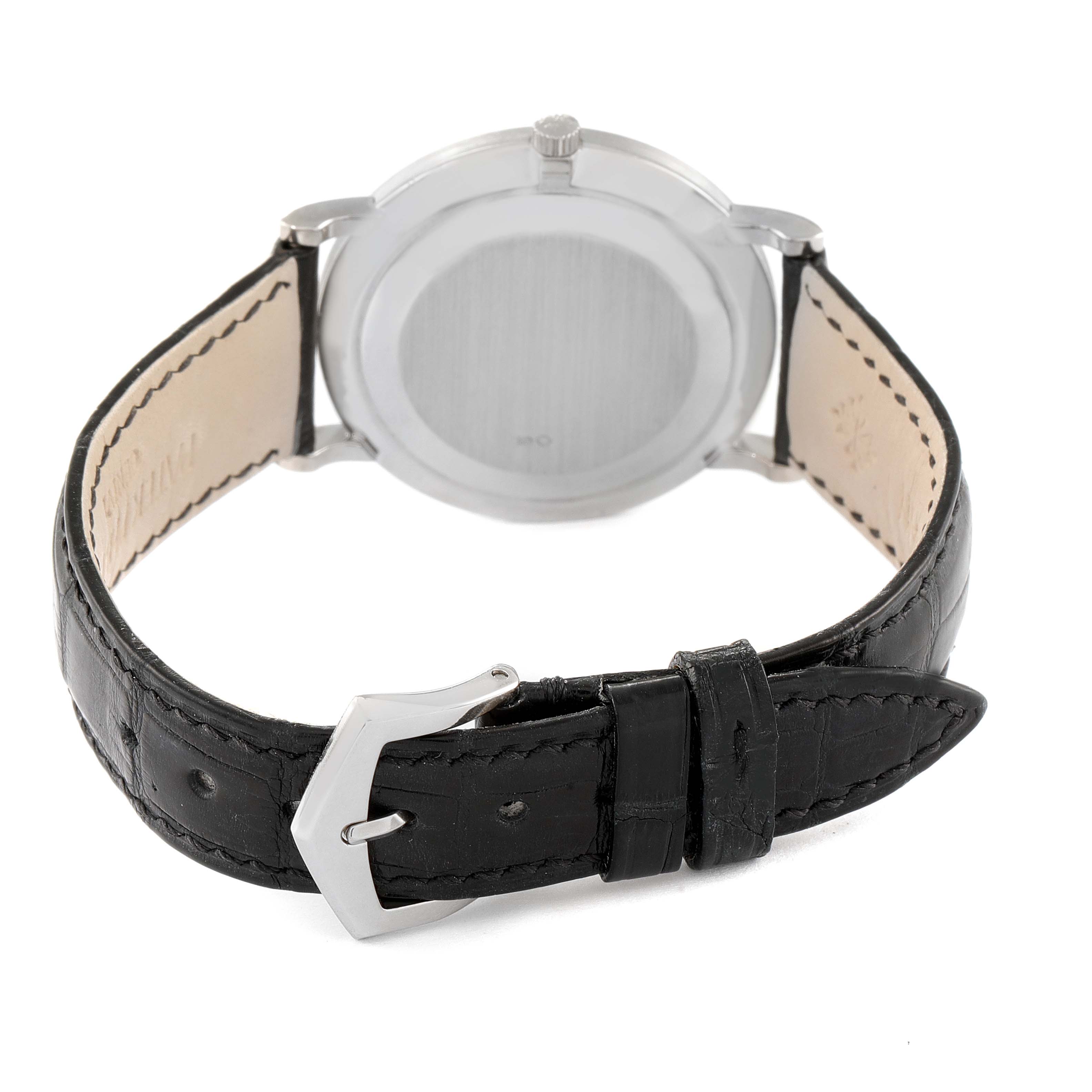 The image shows the back view of a Patek Philippe Calatrava 3919G Men's White Gold White Dial 3919G Men's White Gold White Dial watch, focusing on its caseback and black leather strap with a buckle.