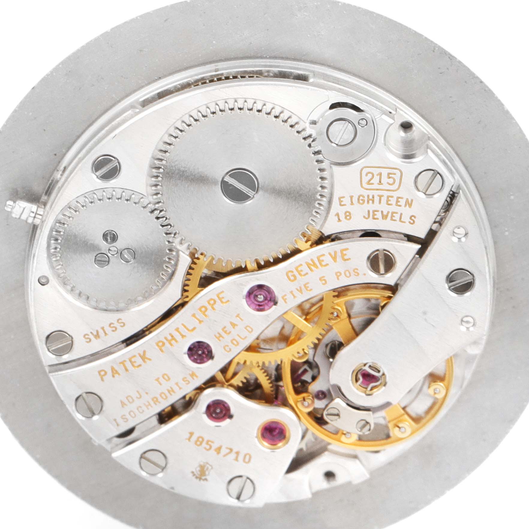 The image shows the intricate internal mechanism of a Calatrava model by Patek Philippe, viewed from the back.