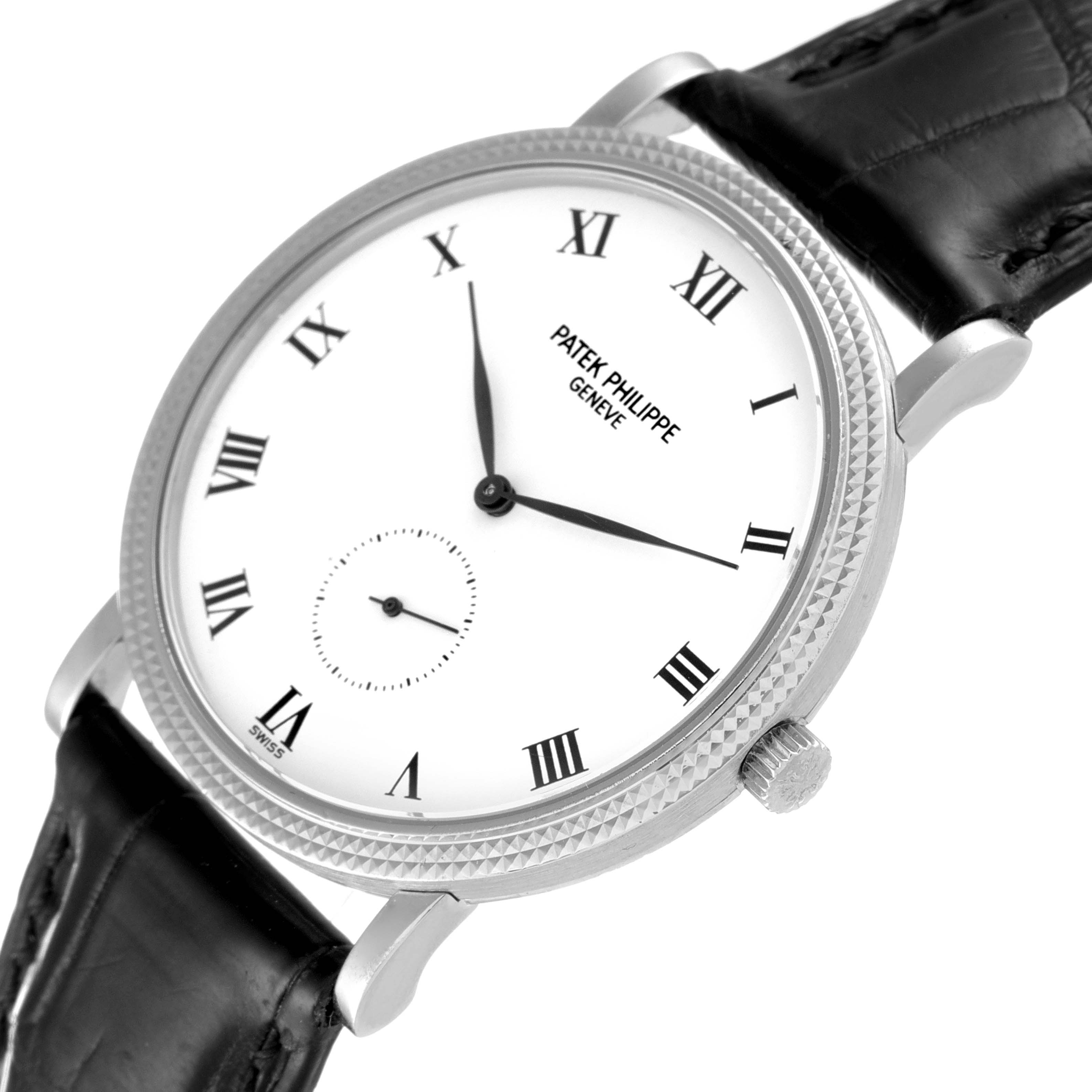 The image shows a close-up, angled view of a Patek Philippe Calatrava 3919G Men's White Gold White Dial 3919G Men's White Gold White Dial watch, highlighting the dial, bezel, crown, and leather strap.