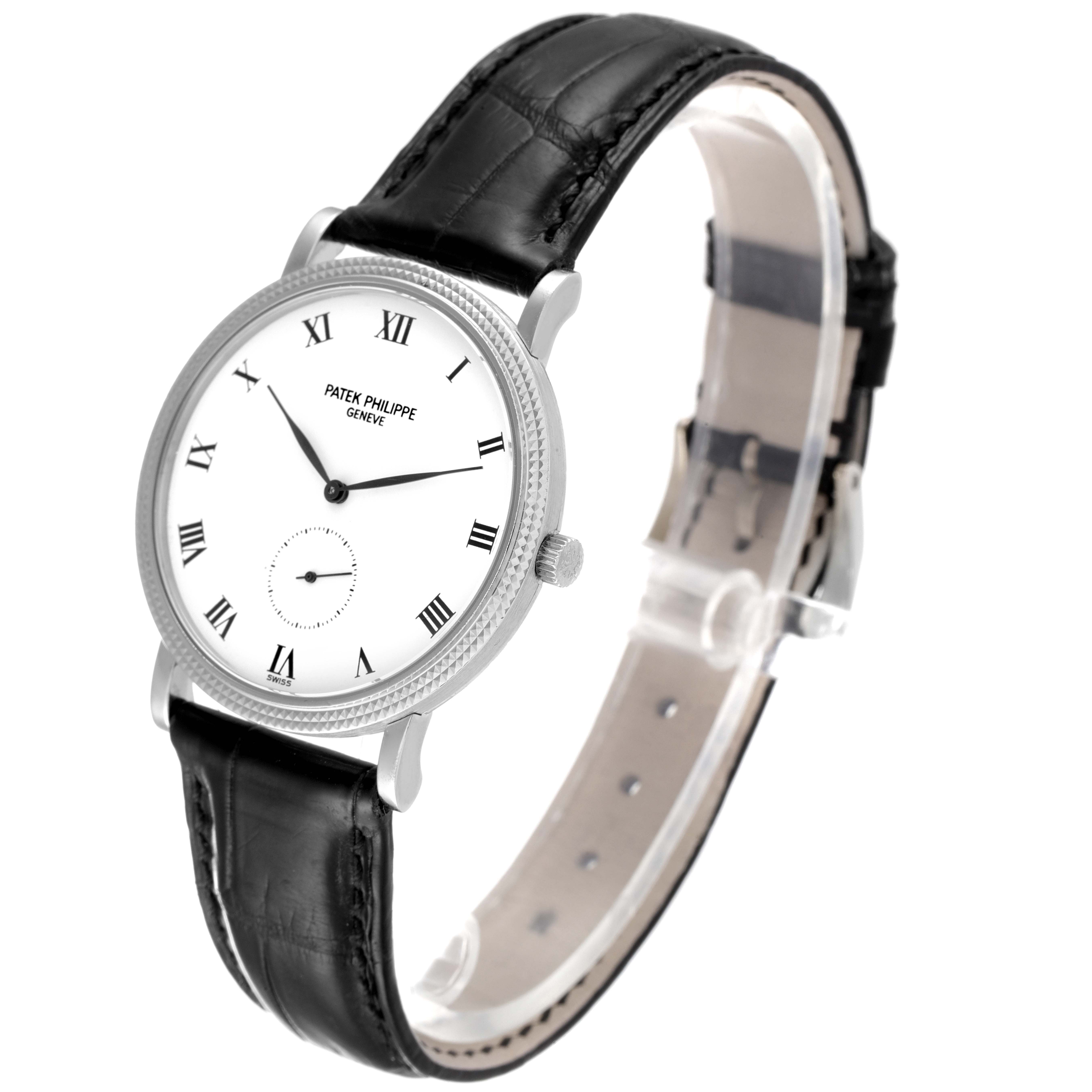 This image shows a Patek Philippe Calatrava 3919G Men's White Gold White Dial 3919G Men's White Gold White Dial watch at a three-quarter angle, highlighting its face, bezel, crown, and strap.