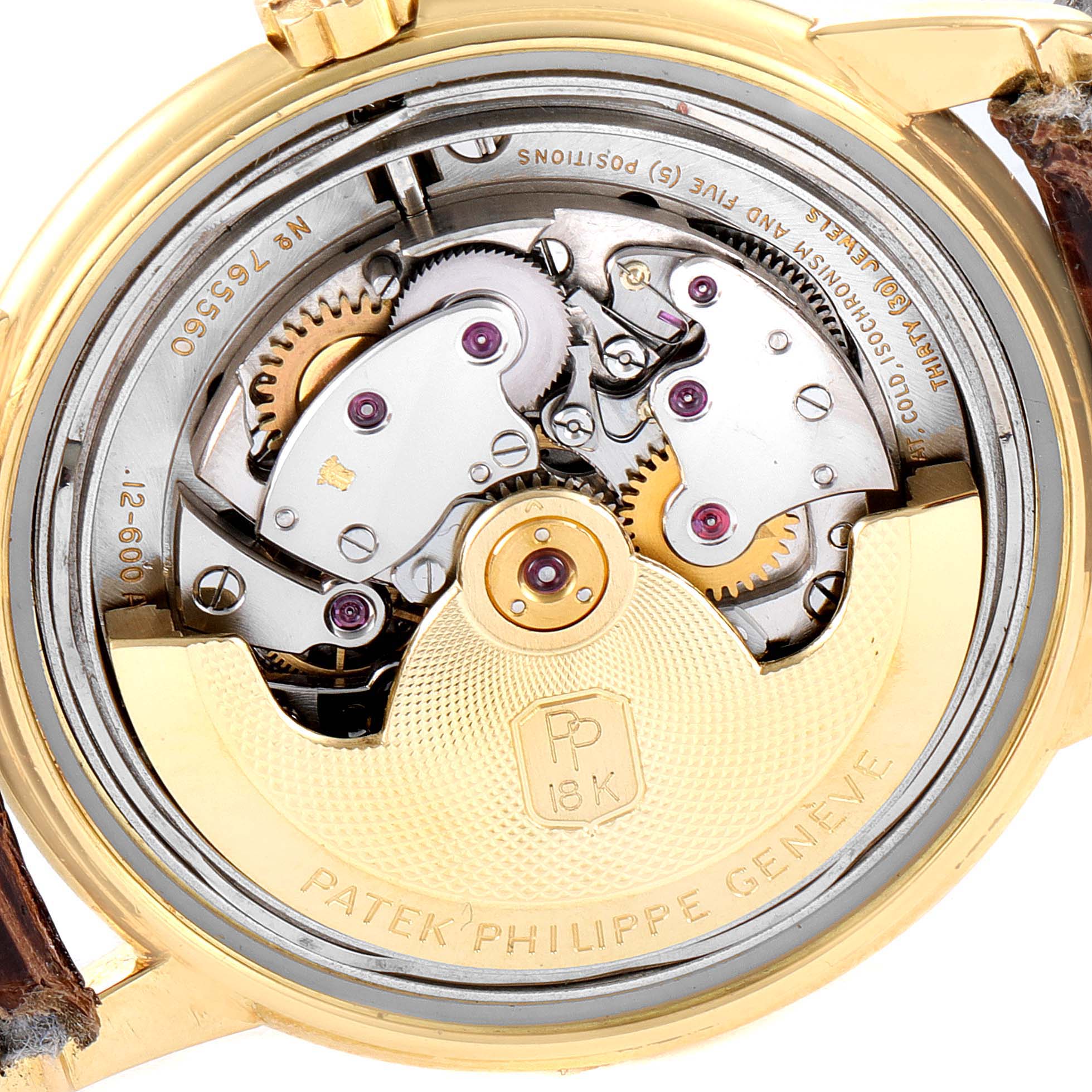 This image shows the back view of the Patek Philippe Calatrava 2551J Men's Yellow Gold Silver Dial 2551J Men's Yellow Gold Silver Dial watch, revealing its intricate movement and gears.