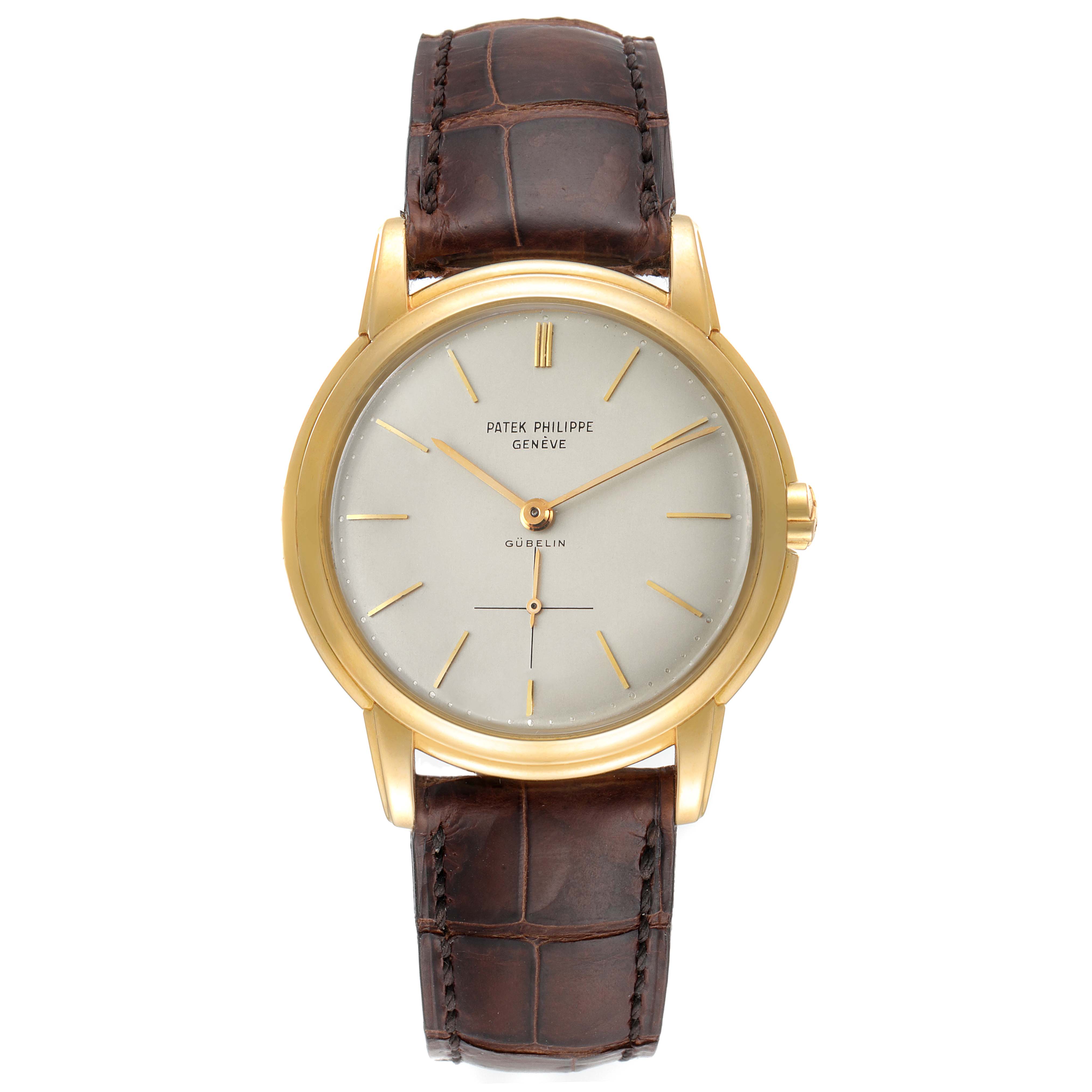 The image shows a front view of the Patek Philippe Calatrava 2551J Men's Yellow Gold Silver Dial 2551J Men's Yellow Gold Silver Dial watch with its face, brown leather strap, and gold case visible.