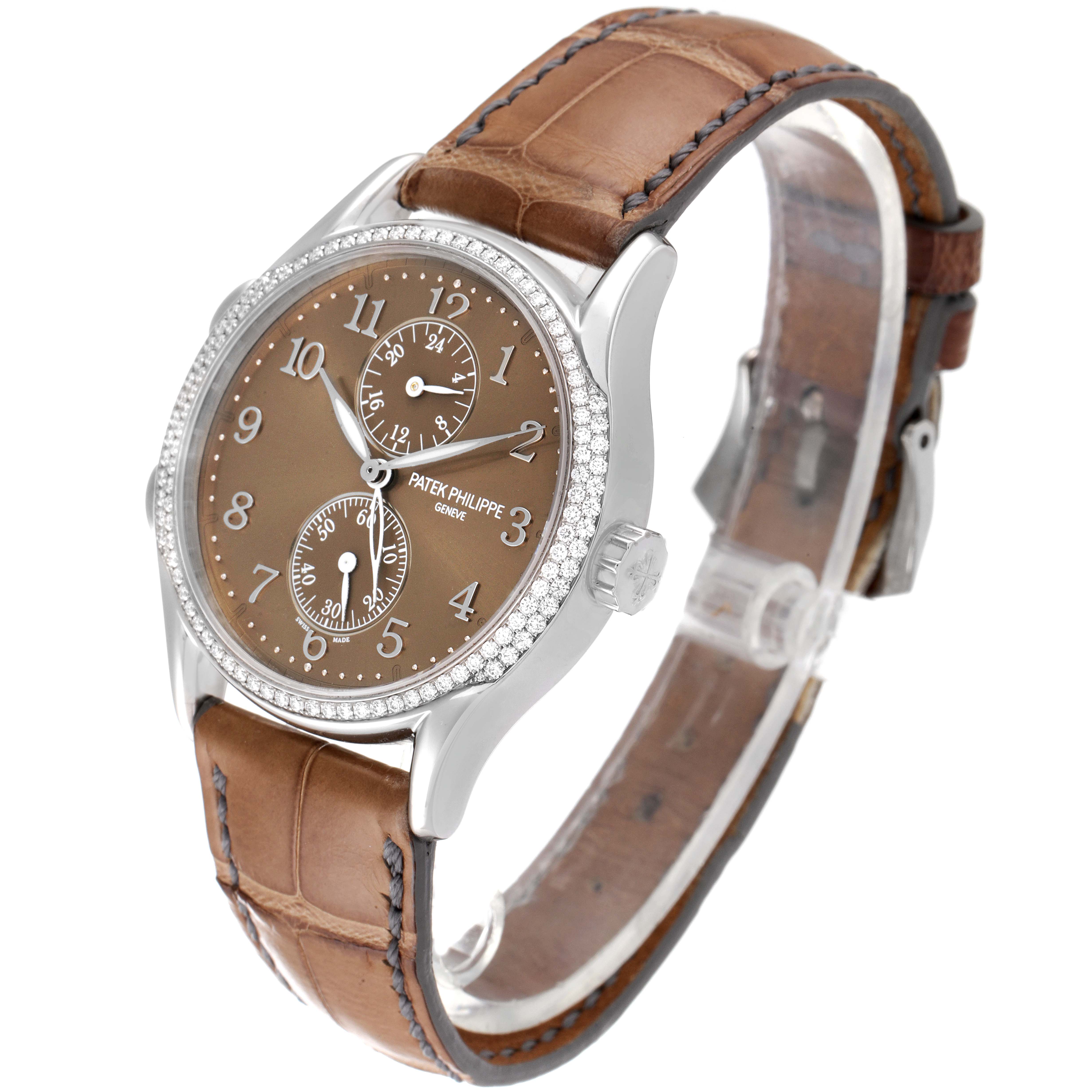 The image shows a Patek Philippe Calatrava 7134G-001 Men's White Gold Brown Dial 7134G-001 Men's White Gold Brown Dial watch at a front-side angle, highlighting the dial, crown, and leather strap.