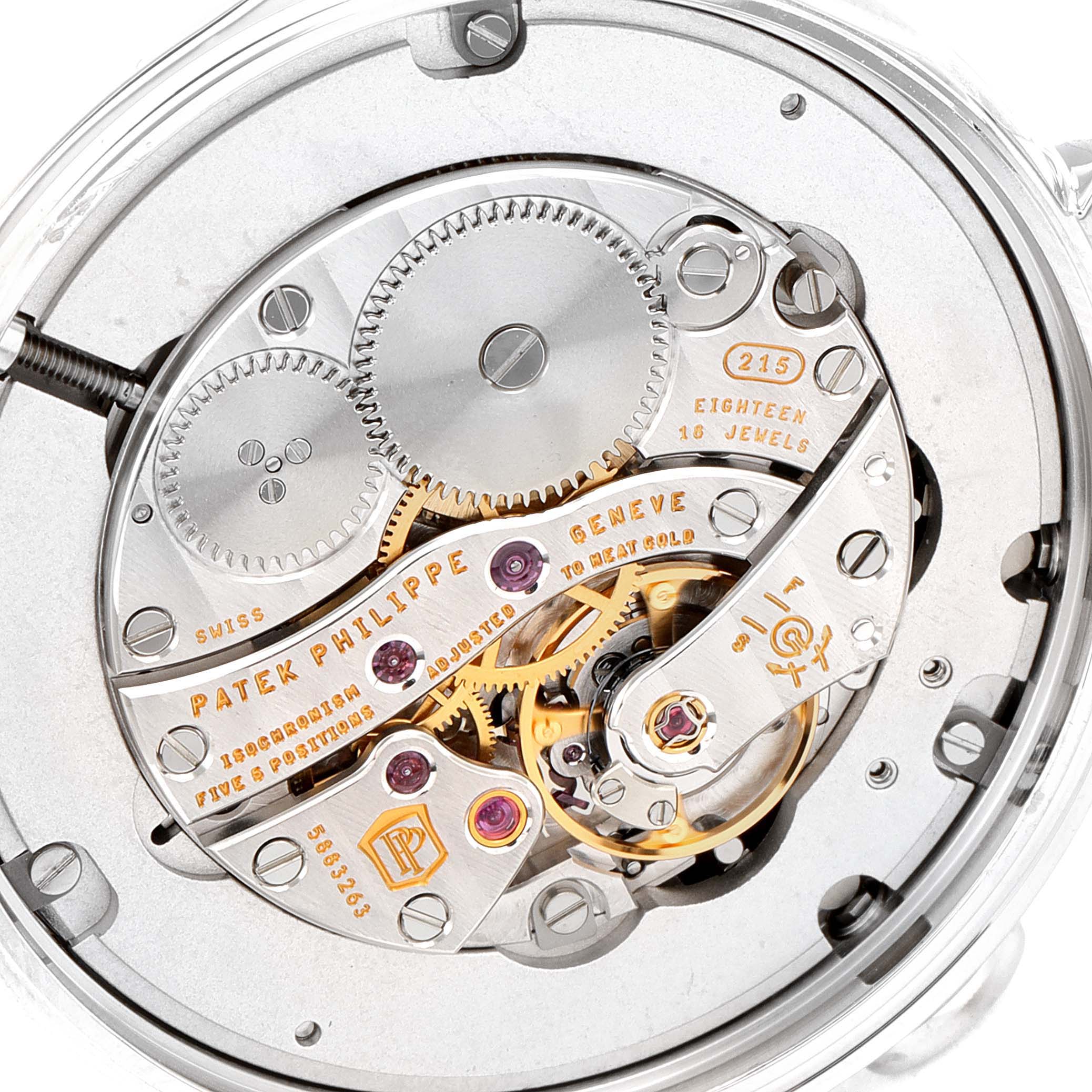 The image shows the intricate movement and internal mechanics of the Calatrava model by Patek Philippe from a close-up, top-down angle.