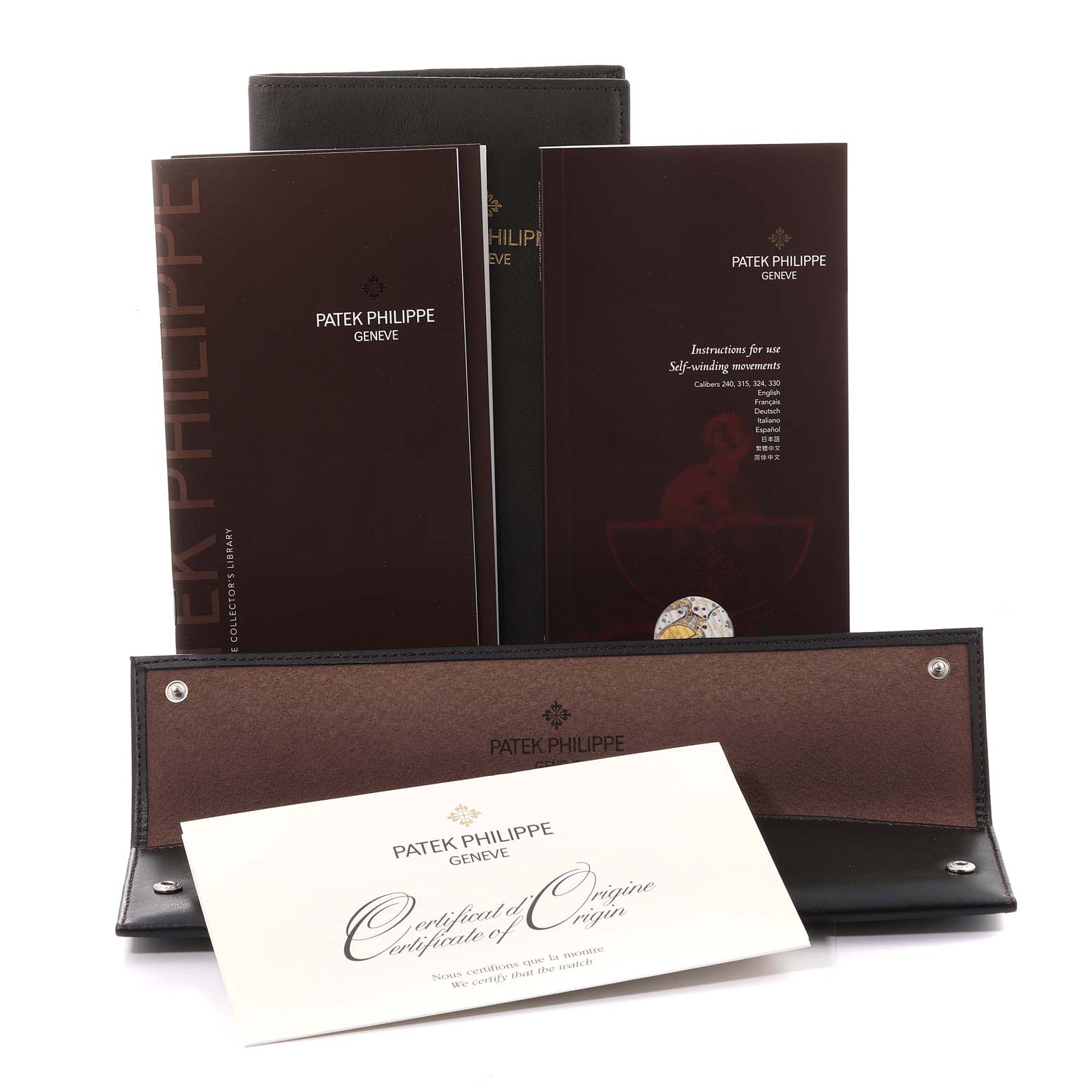 The image shows the documentation and packaging materials for a Patek Philippe Calatrava 5296G Men
s White Gold Silver Dial 5296G Men
s White Gold Silver Dial watch.