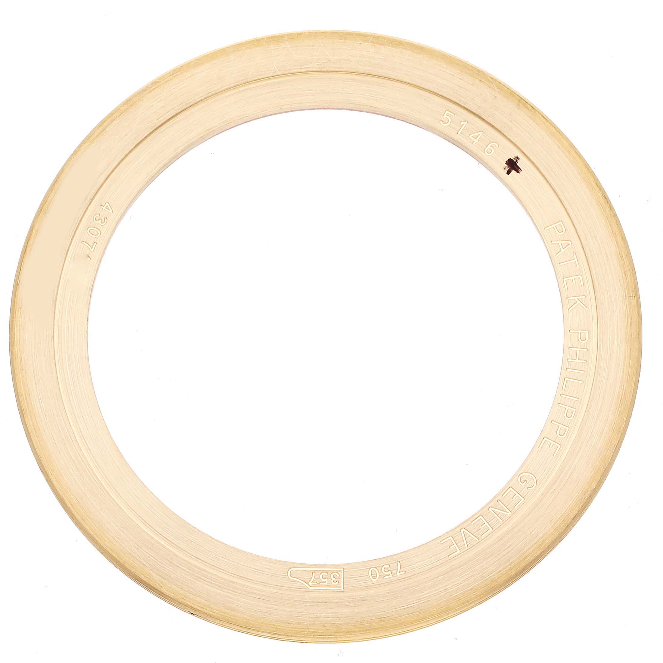 This image shows the bezel of a Patek Philippe Complications 5146J-010 Men's Yellow Gold Grey Dial 5146J-010 Men's Yellow Gold Grey Dial model, viewed from an overhead angle.