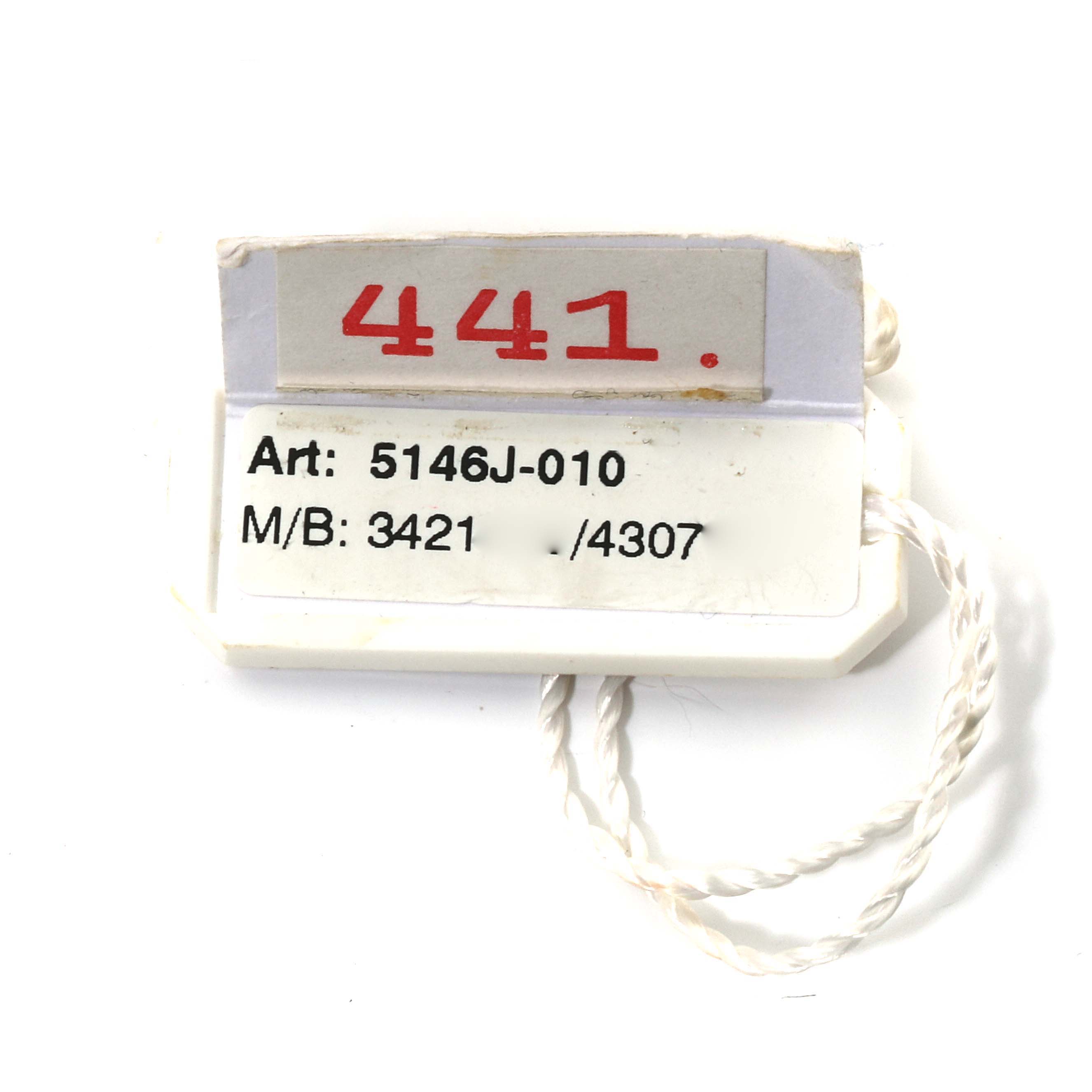 The image shows a tag with reference number information for the Complications model 5146J-010 by Patek Philippe.