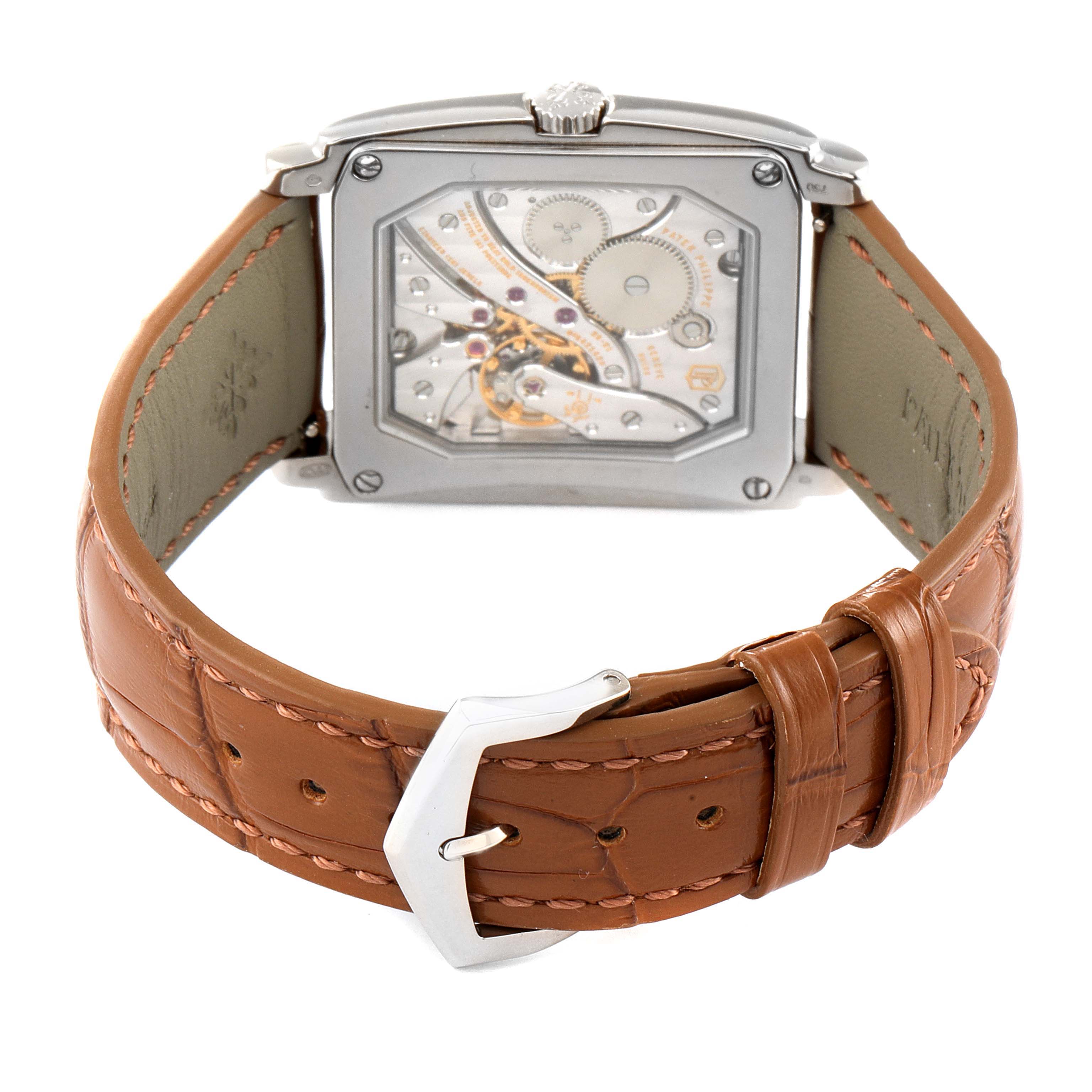 The image shows the back view of a Patek Philippe Gondolo 5124G-001 Men's White Gold Pink Dial 5124G-001 Men's White Gold Pink Dial watch, highlighting its movement and brown leather strap.