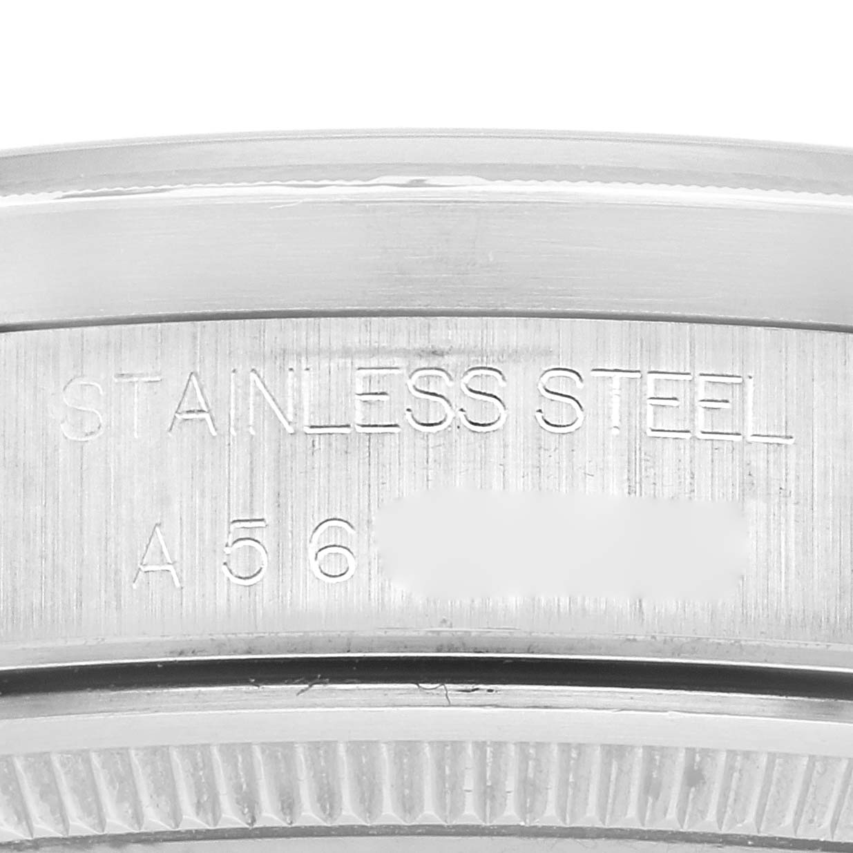 This image shows a close-up of the engraved stainless steel case back of a Rolex Air-King 14010 Men's Stainless Steel Black Dial 14010 Men's Stainless Steel Black Dial watch.