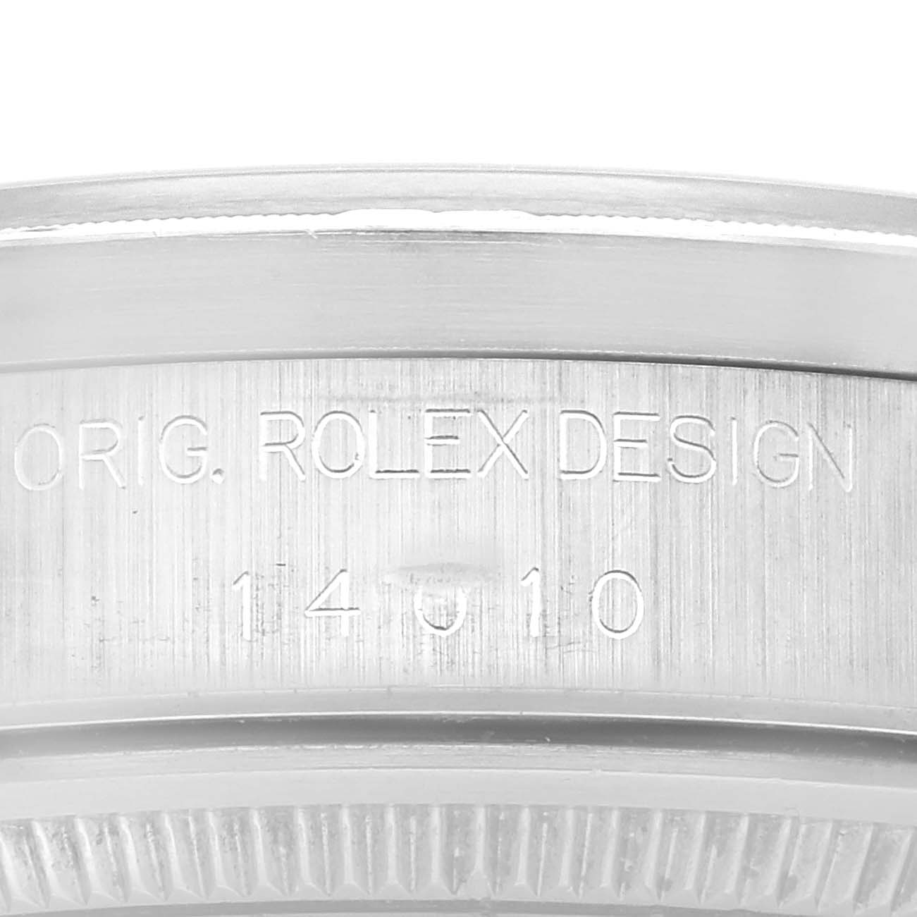 This image shows a close-up of the case side of a Rolex Air-King 14010 Men's Stainless Steel Black Dial 14010 Men's Stainless Steel Black Dial watch, displaying the engraved model number and "Orig. Rolex Design."