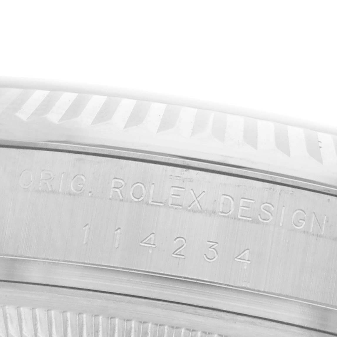 The image shows the engraved serial number on the side of a Rolex Air-King 114234 Men's Stainless Steel Silver Dial 114234 Men's Stainless Steel Silver Dial watch case.