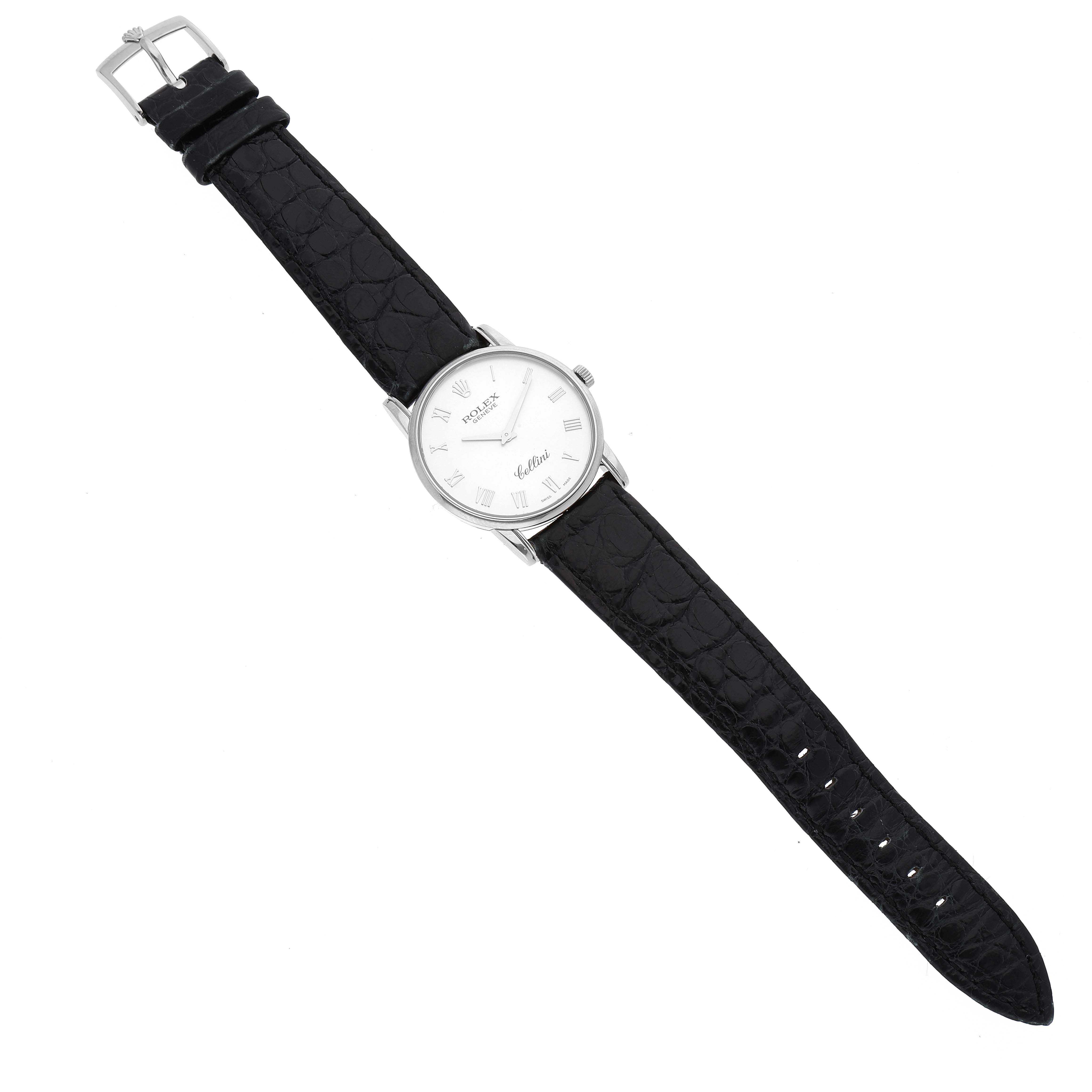 This image shows a top-down view of a Rolex Cellini 5116 Men's White Gold Silver Dial 5116 Men's White Gold Silver Dial watch, displaying its black leather strap, white dial, and silver buckle.