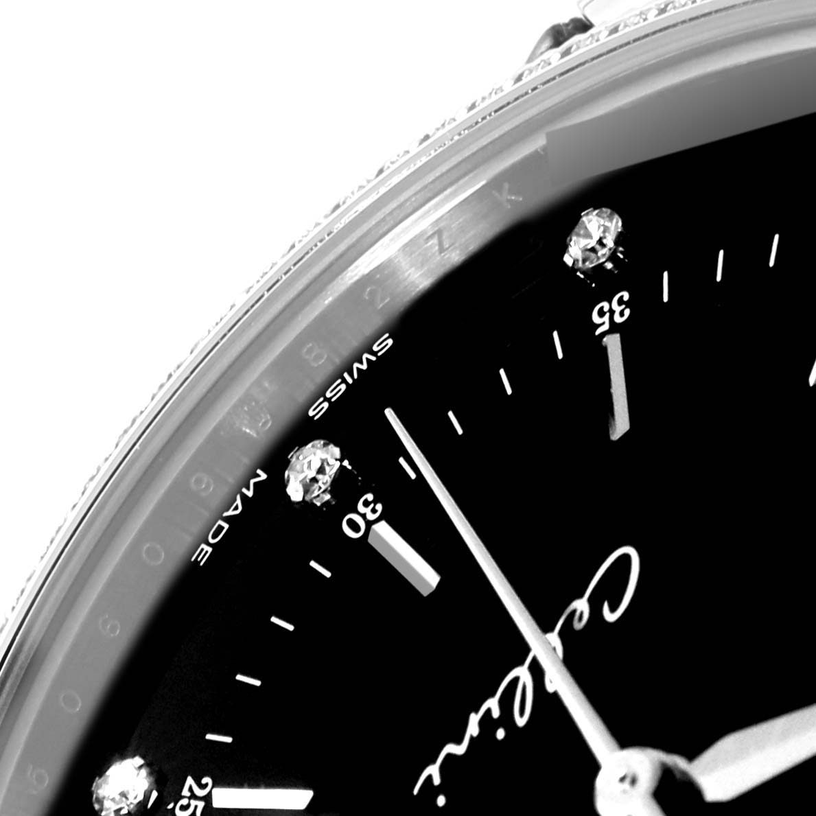 Close-up of a Rolex Cellini 50609RBR Men's White Gold Black Dial 50609RBR Men's White Gold Black Dial watch face showing partial dial, minute markers, and "Swiss Made" text.