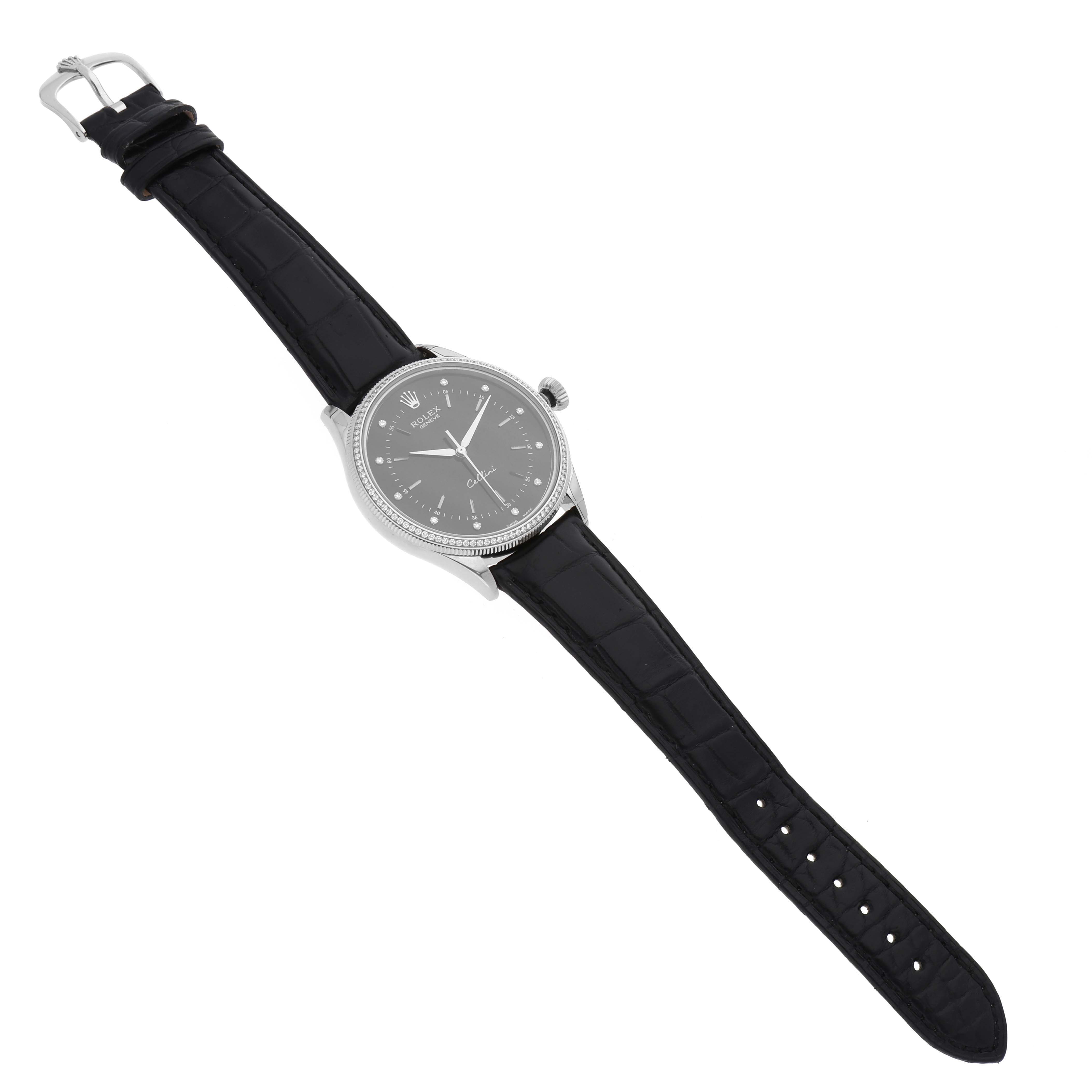 The Rolex Cellini 50609RBR Men's White Gold Black Dial 50609RBR Men's White Gold Black Dial watch is shown from an angled top-down perspective, displaying its face, case, crown, and black leather strap.