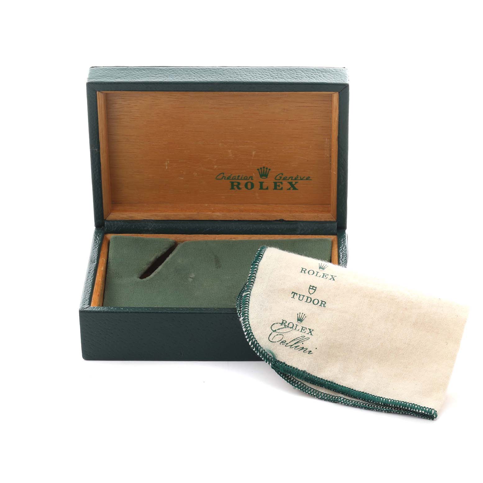 The image shows a Rolex Date 15037 Men
s Yellow Gold Champagne Dial 15037 Men
s Yellow Gold Champagne Dial model accessory consisting of an open green and wood-tone box and a branded cleaning cloth.