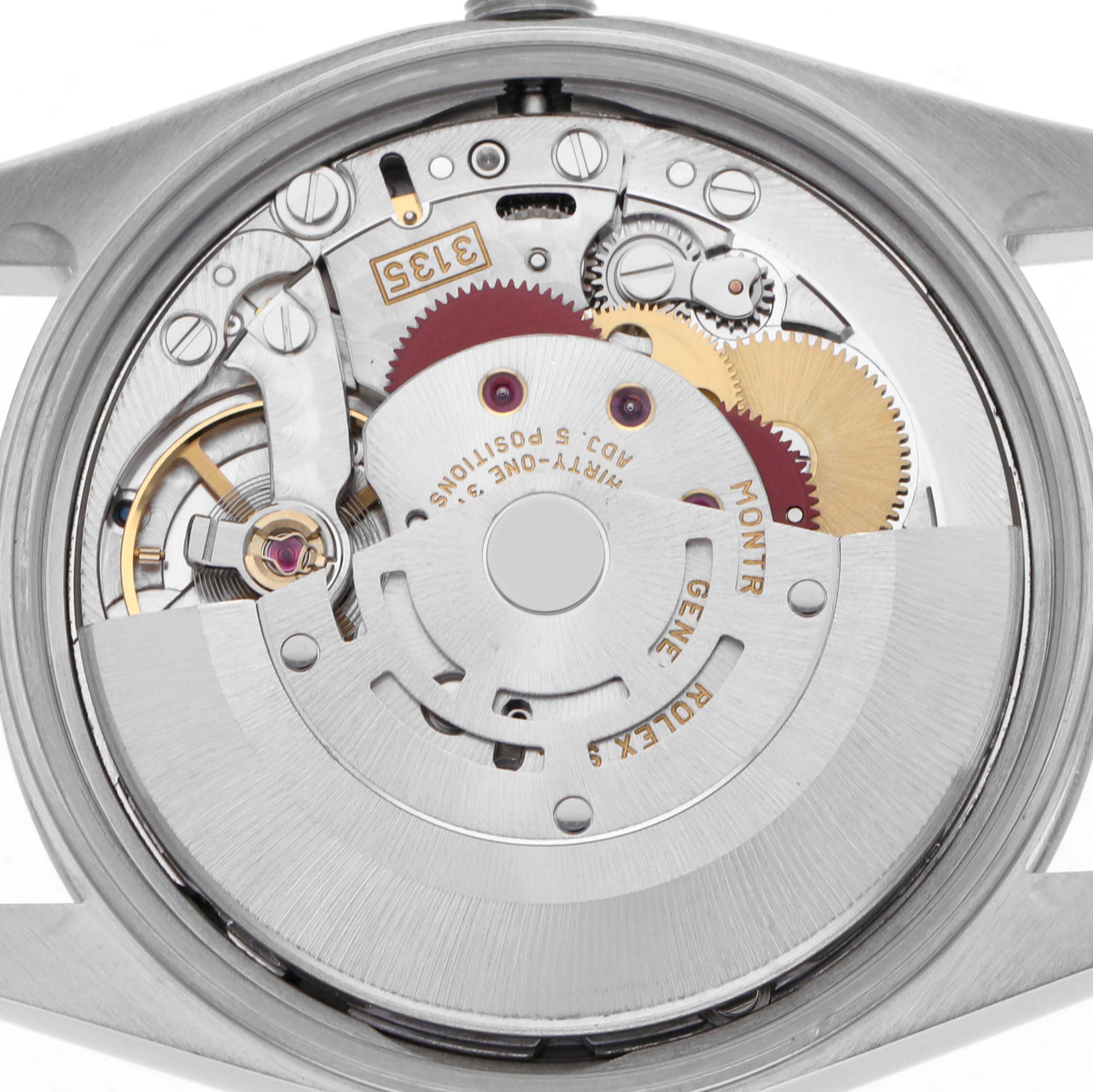 The image shows the movement mechanism of a Rolex Date 15200 Men's Stainless Steel Black Dial 15200 Men's Stainless Steel Black Dial, viewed from the back with visible gears and rotor.