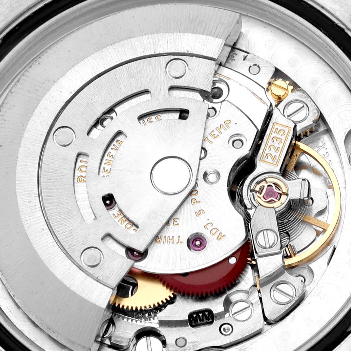 This image shows a close-up view of the intricate internal mechanisms of a mid-size Rolex watch.