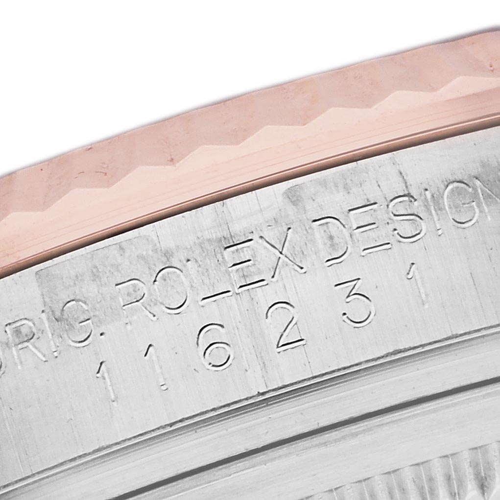 The image shows a close-up of the engraved inner bezel of a Rolex Datejust 116231 Men's Steel and Gold (two tone) Black Dial 116231 Men's Steel and Gold (two tone) Black Dial watch, focusing on the model number.
