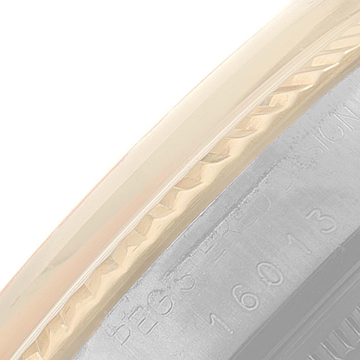 This close-up image shows the edge and part of the bezel of a Rolex Vintage Collection 16013 Men's Steel and Gold (two tone) Silver Dial 16013 Men's Steel and Gold (two tone) Silver Dial watch, highlighting the engraved details.