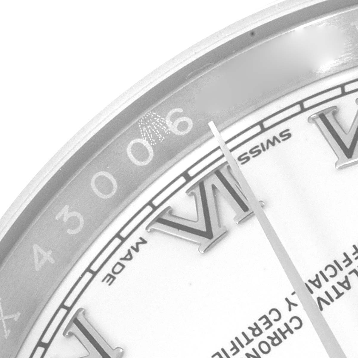 This image shows a close-up angle of the bezel and part of the dial of a Rolex Datejust 116200 Men's Stainless Steel White Dial 116200 Men's Stainless Steel White Dial watch.
