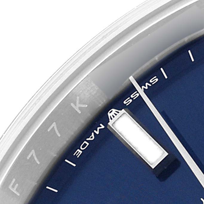 This image shows a close-up of the dial of a Rolex Datejust 41 126300 Men's Stainless Steel Blue Dial 126300 Men's Stainless Steel Blue Dial watch, focusing on the hour markers, Swiss Made text, and part of the bezel.