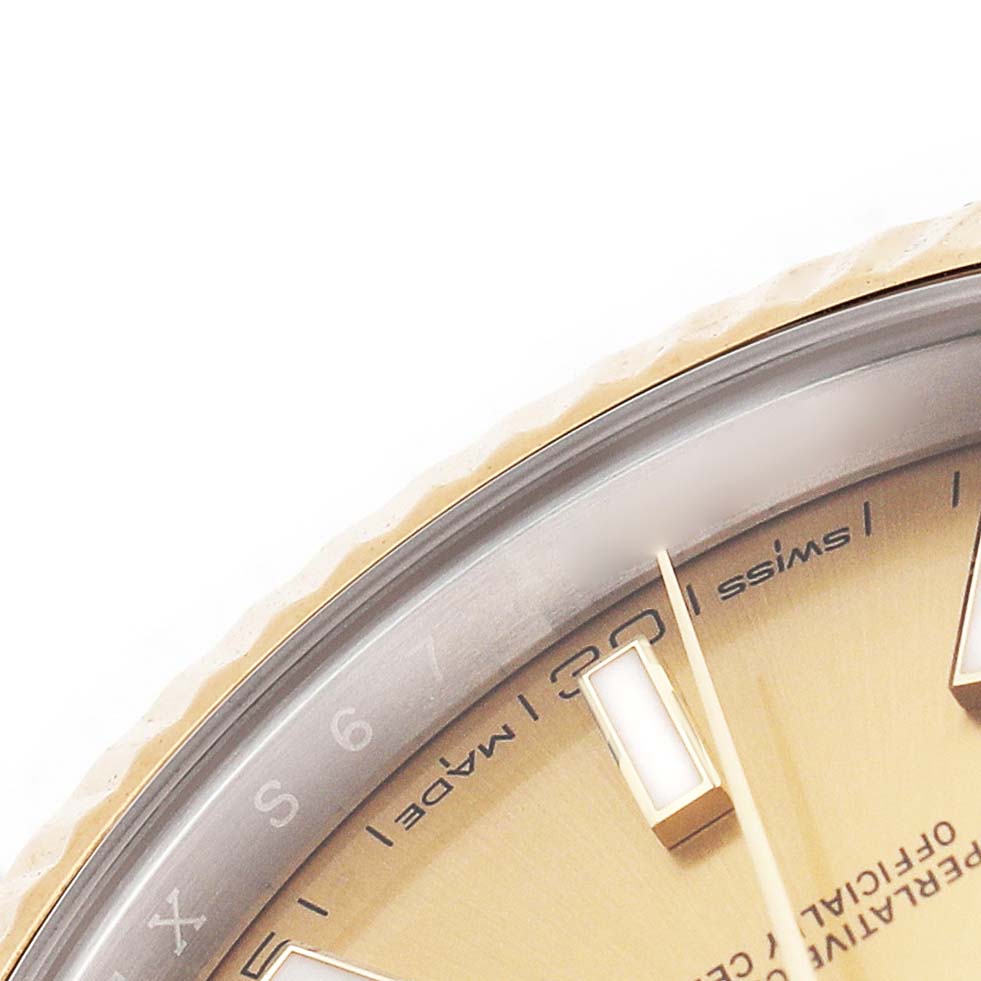 The image shows a close-up of the Rolex Datejust 41 126333 Men's Steel and Gold (two tone) Champagne Dial dial, highlighting the gold fluted bezel and hour markers.