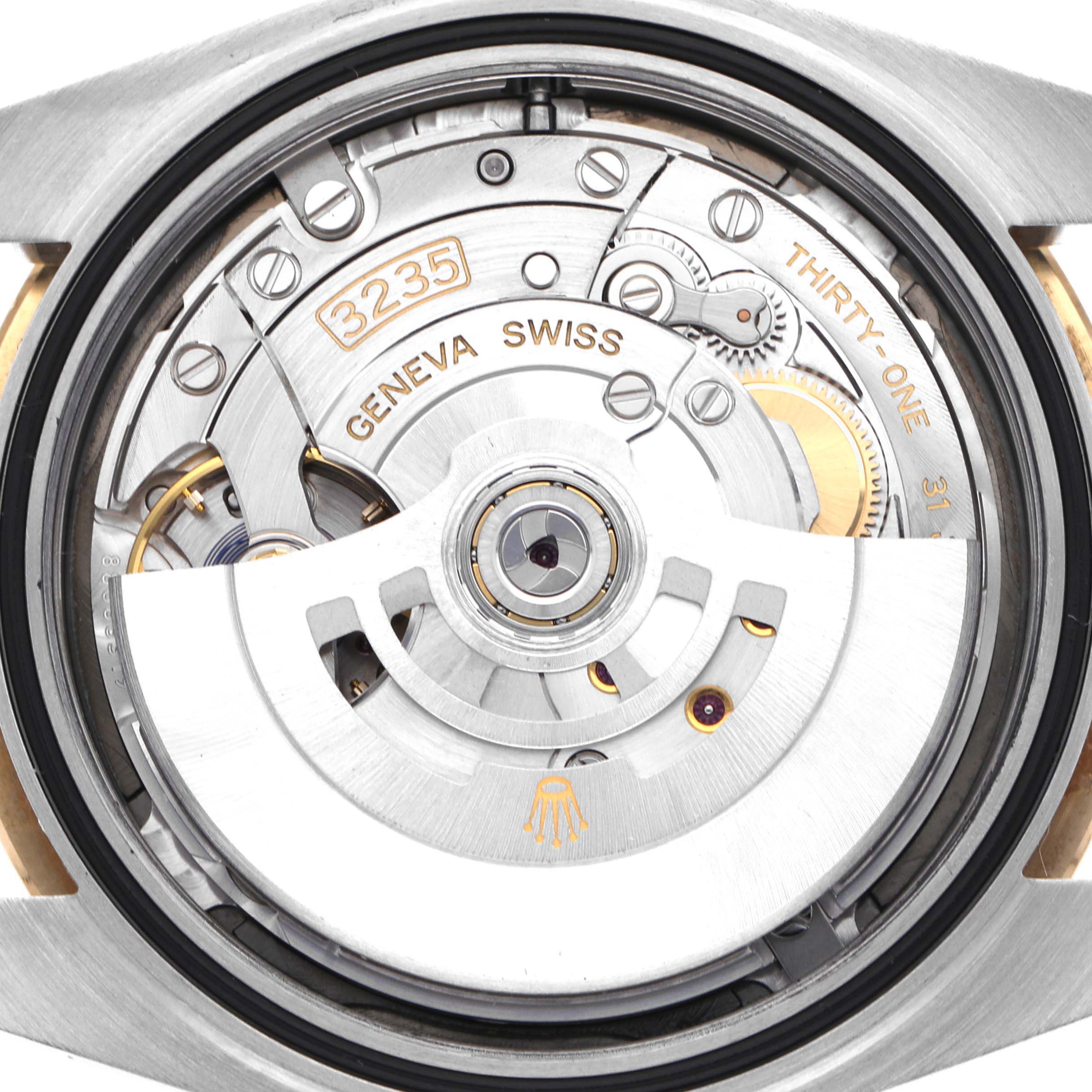 The image shows the movement of a Rolex Datejust 41 126333 Men's Steel and Gold (two tone) Grey Dial 126333 Men's Steel and Gold (two tone) Grey Dial, featuring the 3235 caliber with visible gears and markings.