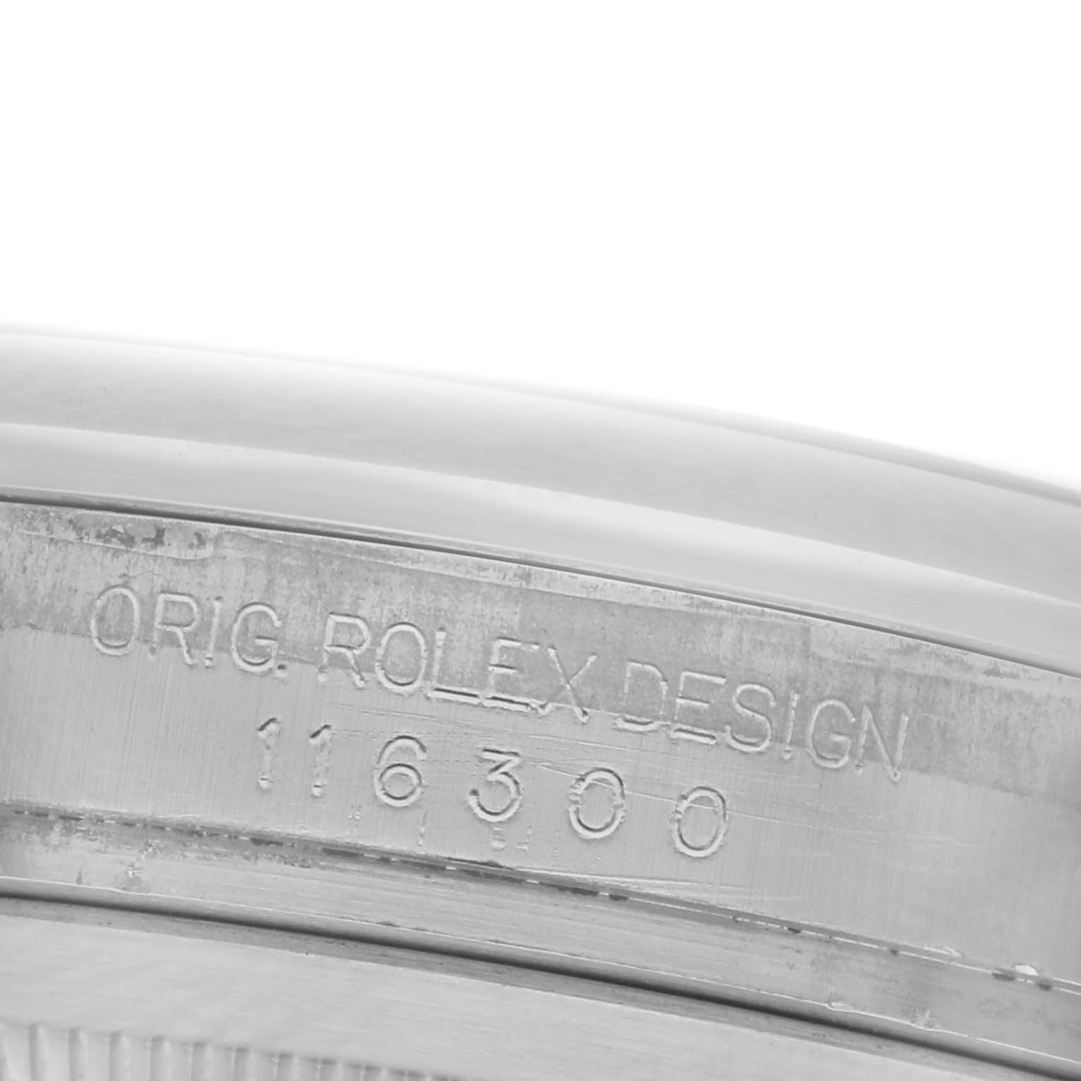 The image shows a close-up of the engraved case edge of a Rolex Datejust 41 116300 Men's Stainless Steel Blue Dial 116300 Men's Stainless Steel Blue Dial, displaying "ORIG. ROLEX DESIGN 116300".