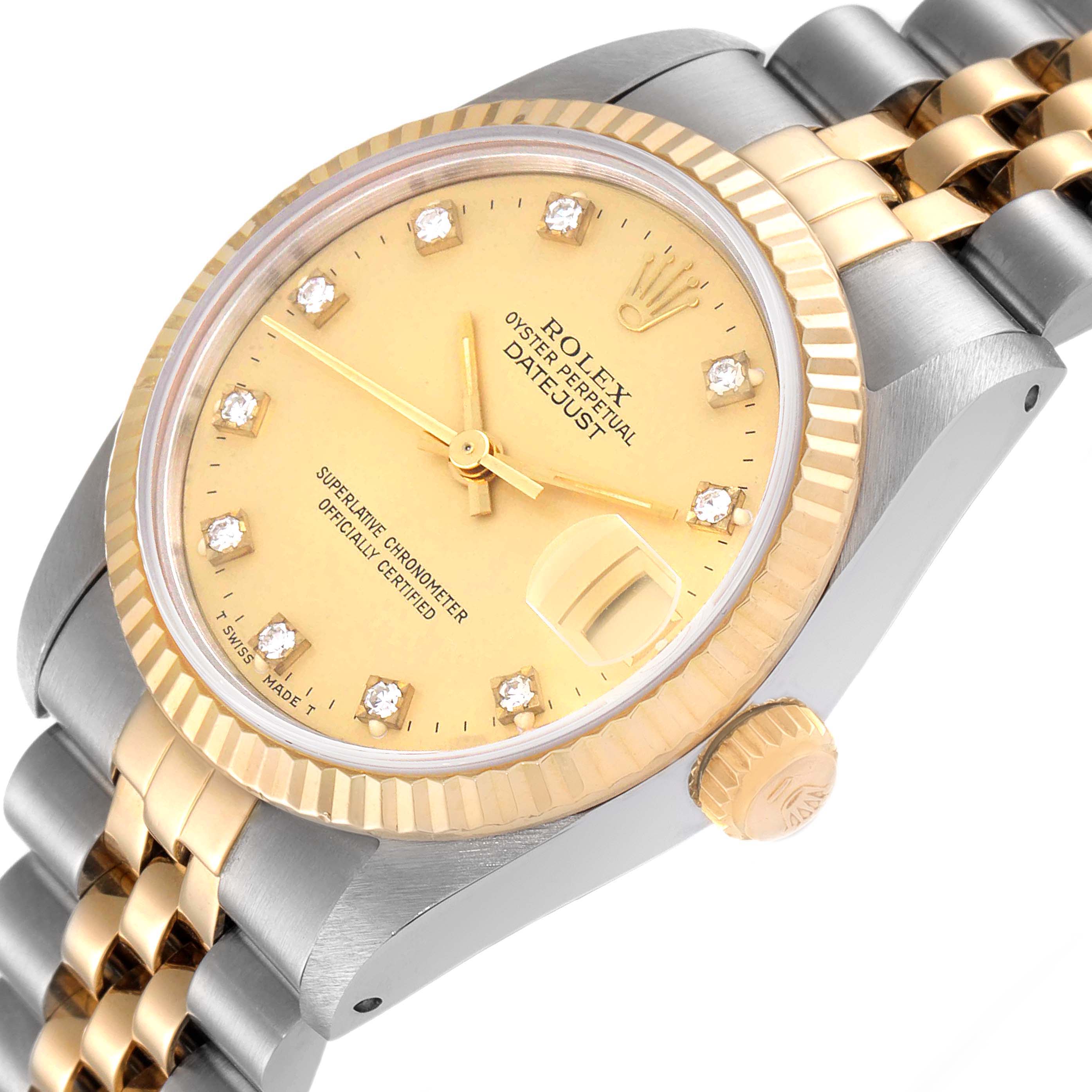 The image shows a Rolex Mid-Size 68273 Women
s Steel and Gold (two tone) Champagne Dial 68273 Women
s Steel and Gold (two tone) Champagne Dial Datejust watch at an angled view highlighting its dial, bezel, crown, and bracelet.